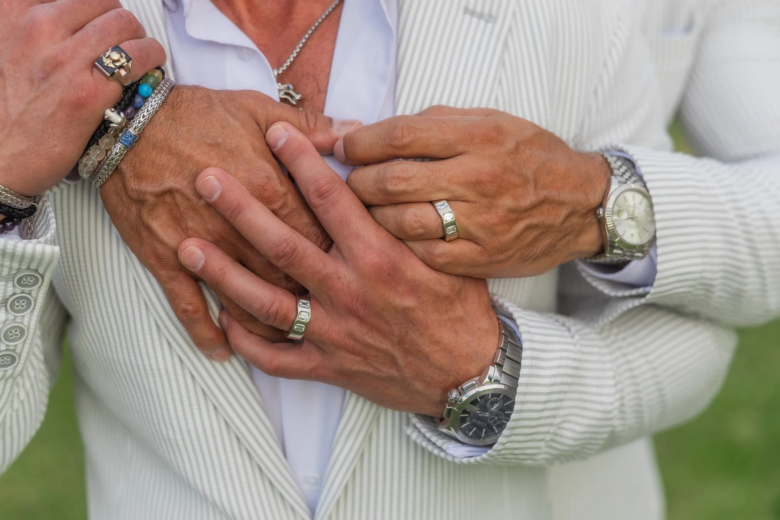 Grooms holding hands during an LGBT elopement shot by a Puerto Rico LGBT photographer