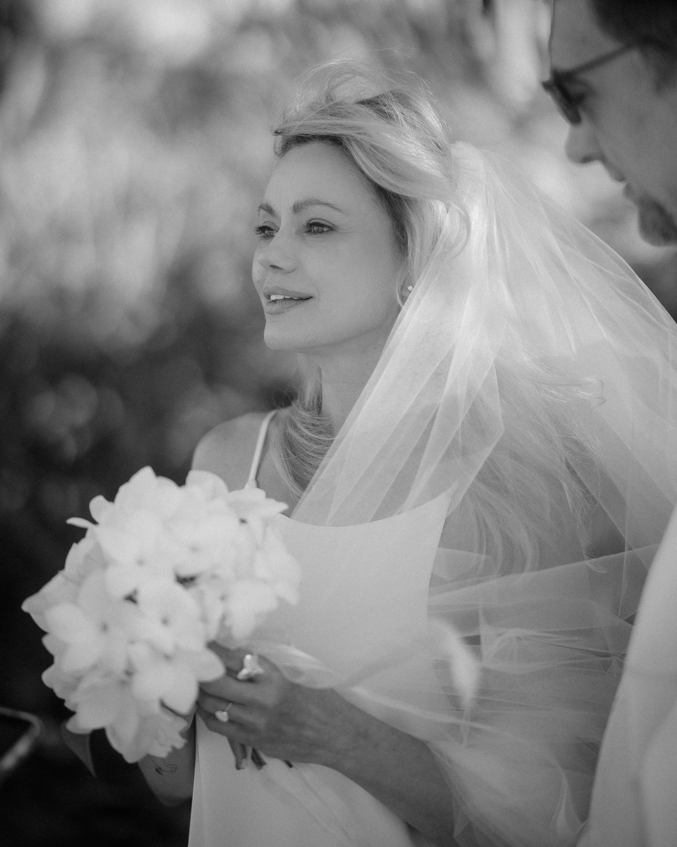 Bride looking off into a Escambrón Beach during an elopement in Puerto Rico