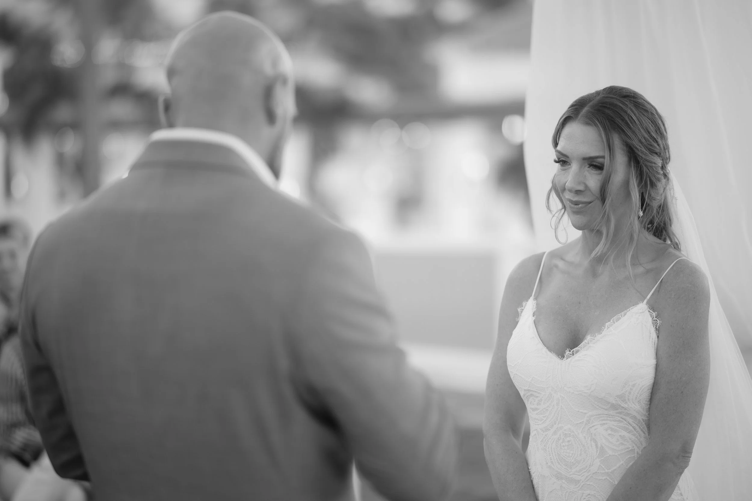 Bride listening to groom during ceremony at El Conquistador Resort taken by a Puerto Rico wedding photographer