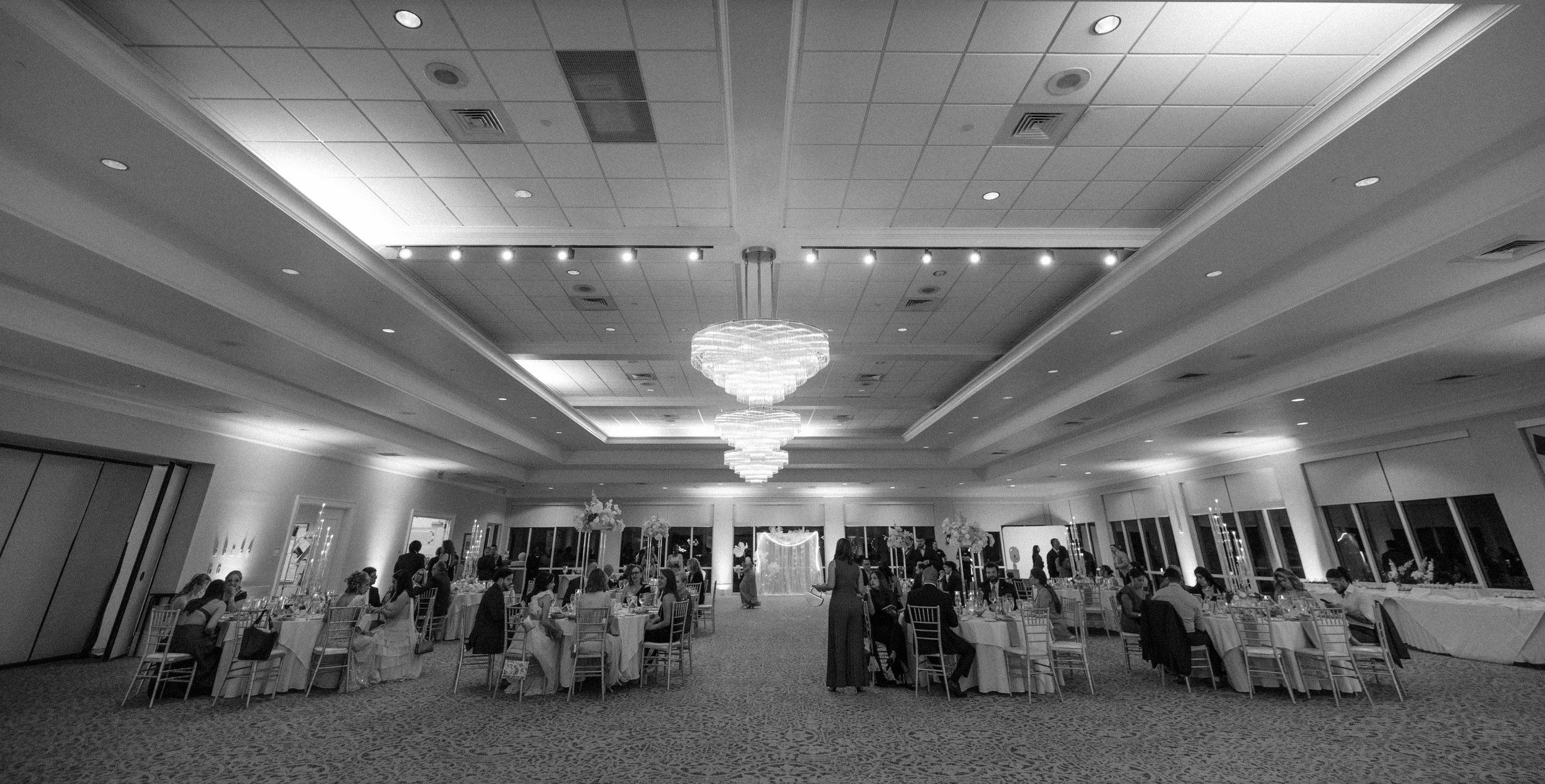 Wide shot of the reception hall at the Indian Spring Country Club taken by a luxury wedding photographer in South Florida.