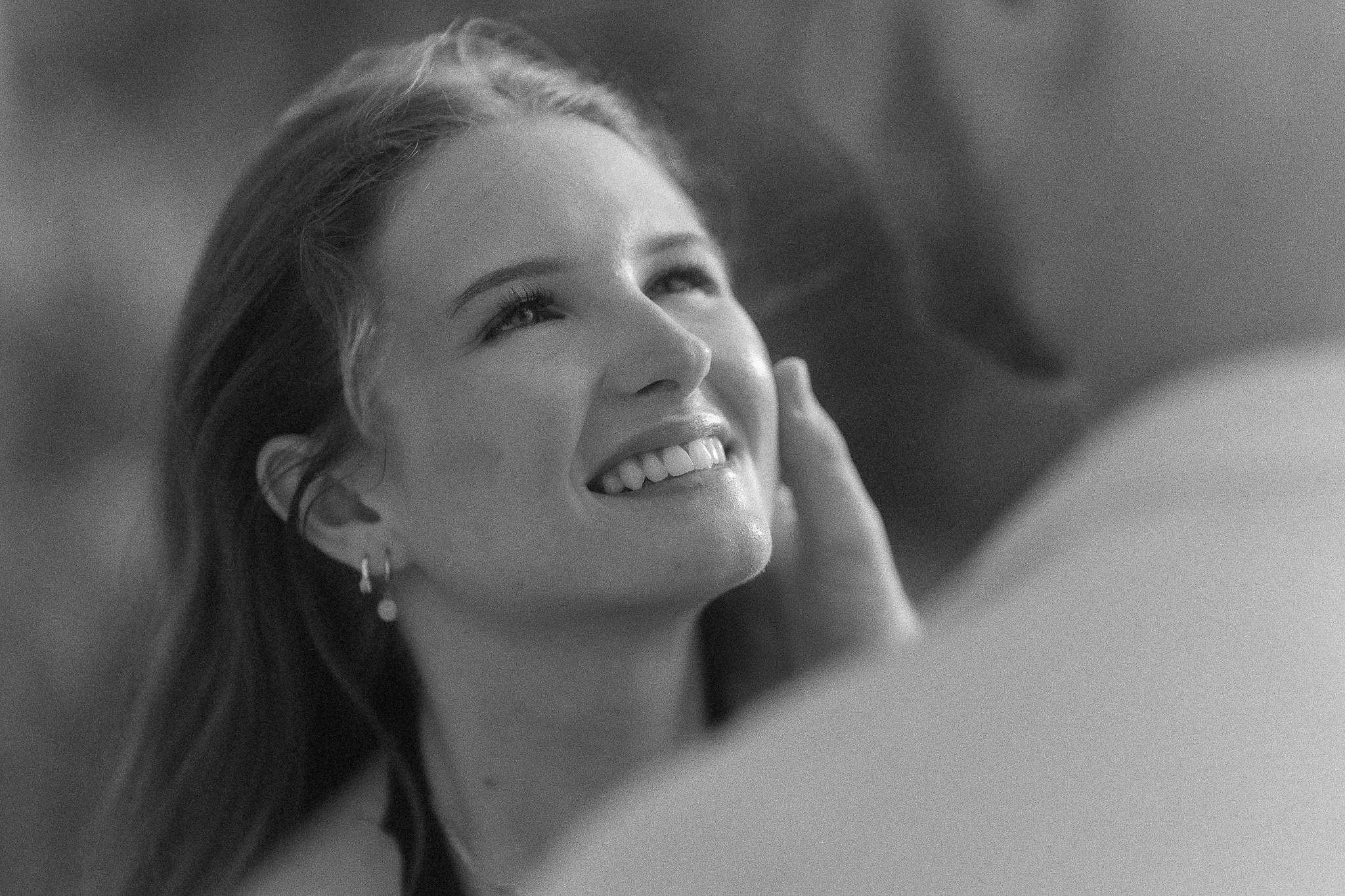 Woman embracing man during an engagement session after a surprise marriage proposal in Puerto Rico at the Hyatt Regency Grand Reserve