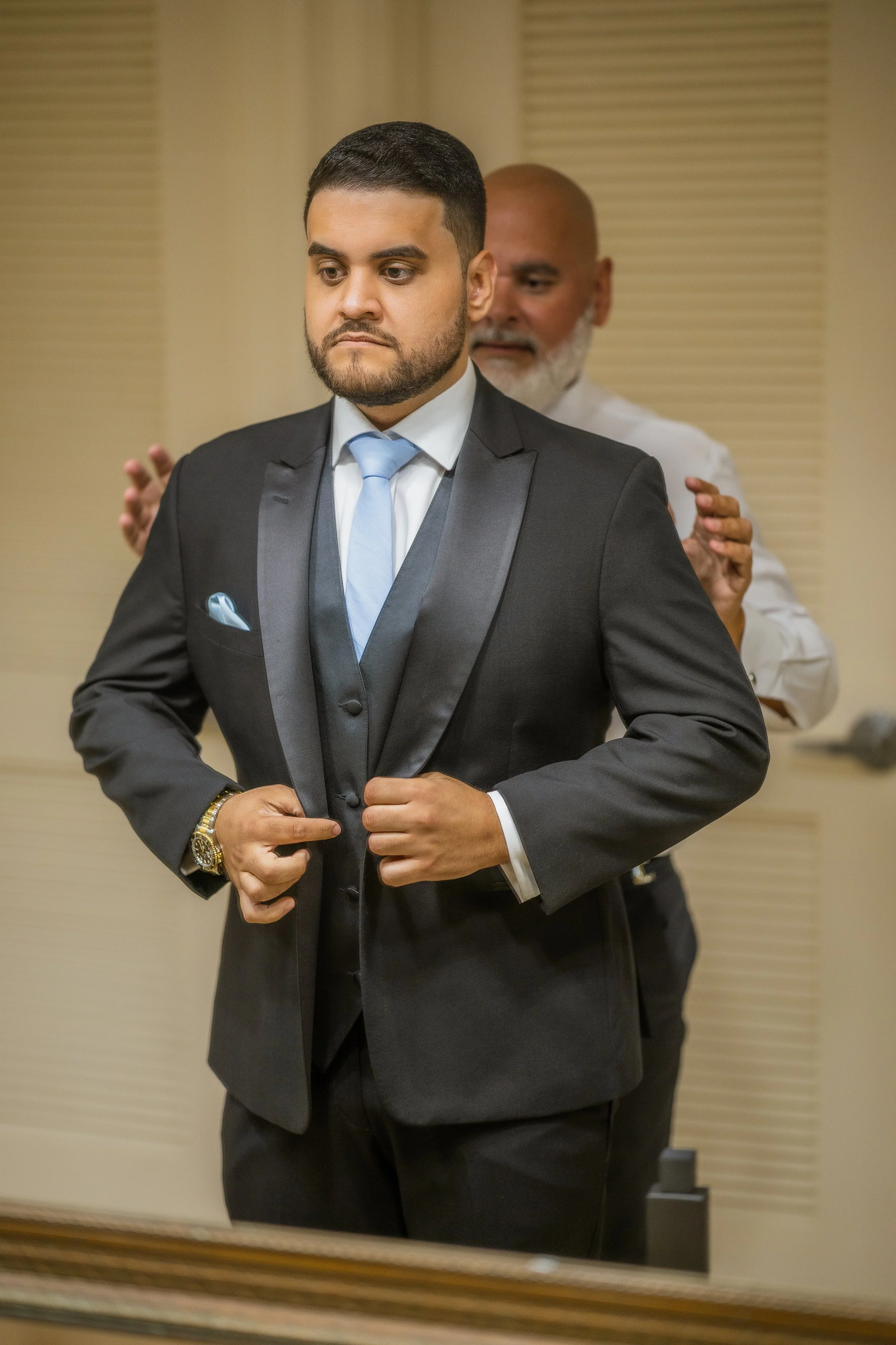 Groom getting ready at Indian Spring Country Club for his luxury wedding taken by a Florida elopement photographer