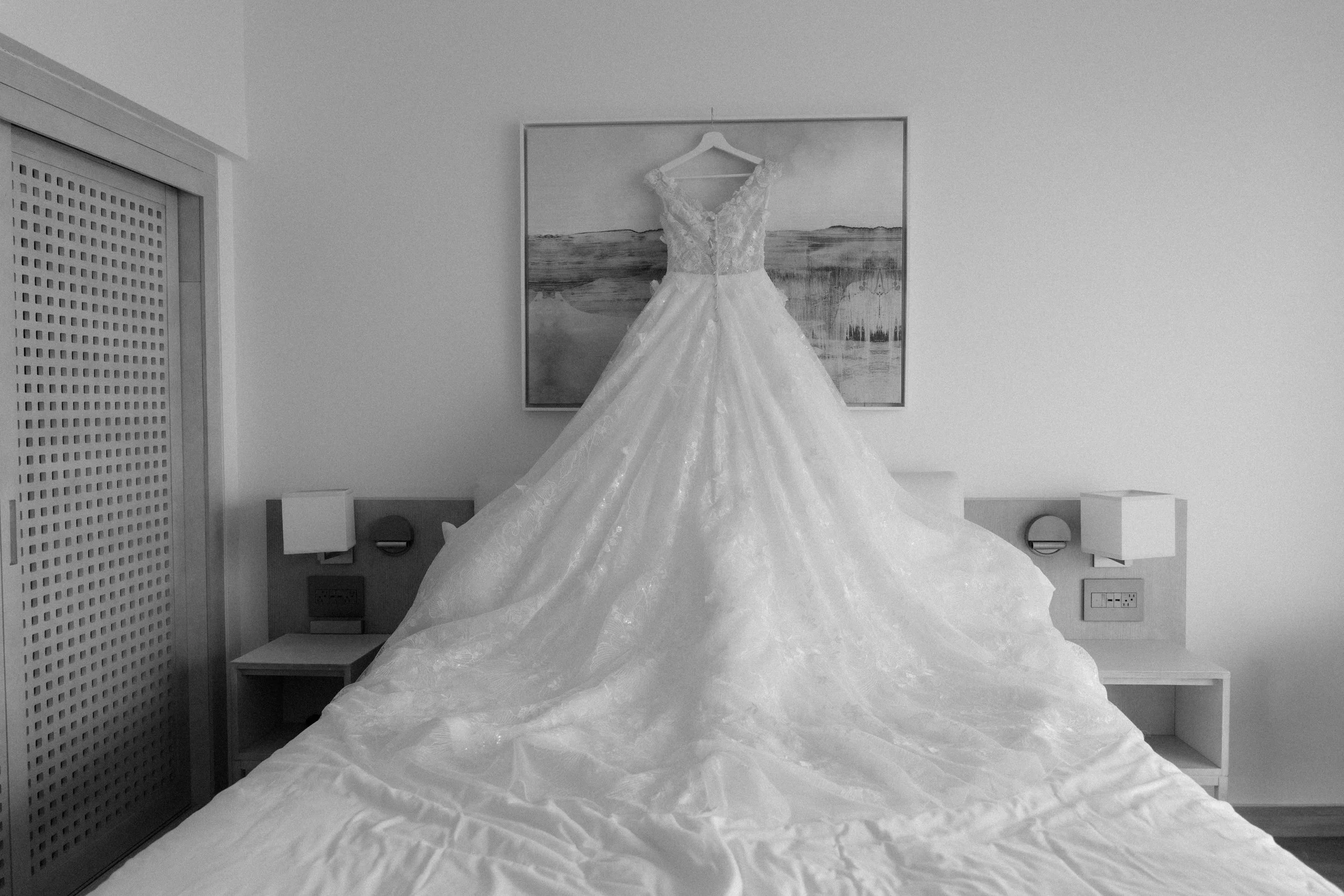 Luxury bridal dress hanging at La Concha Renaissance Hotel taken by an editorial wedding photographer in Puerto Rico