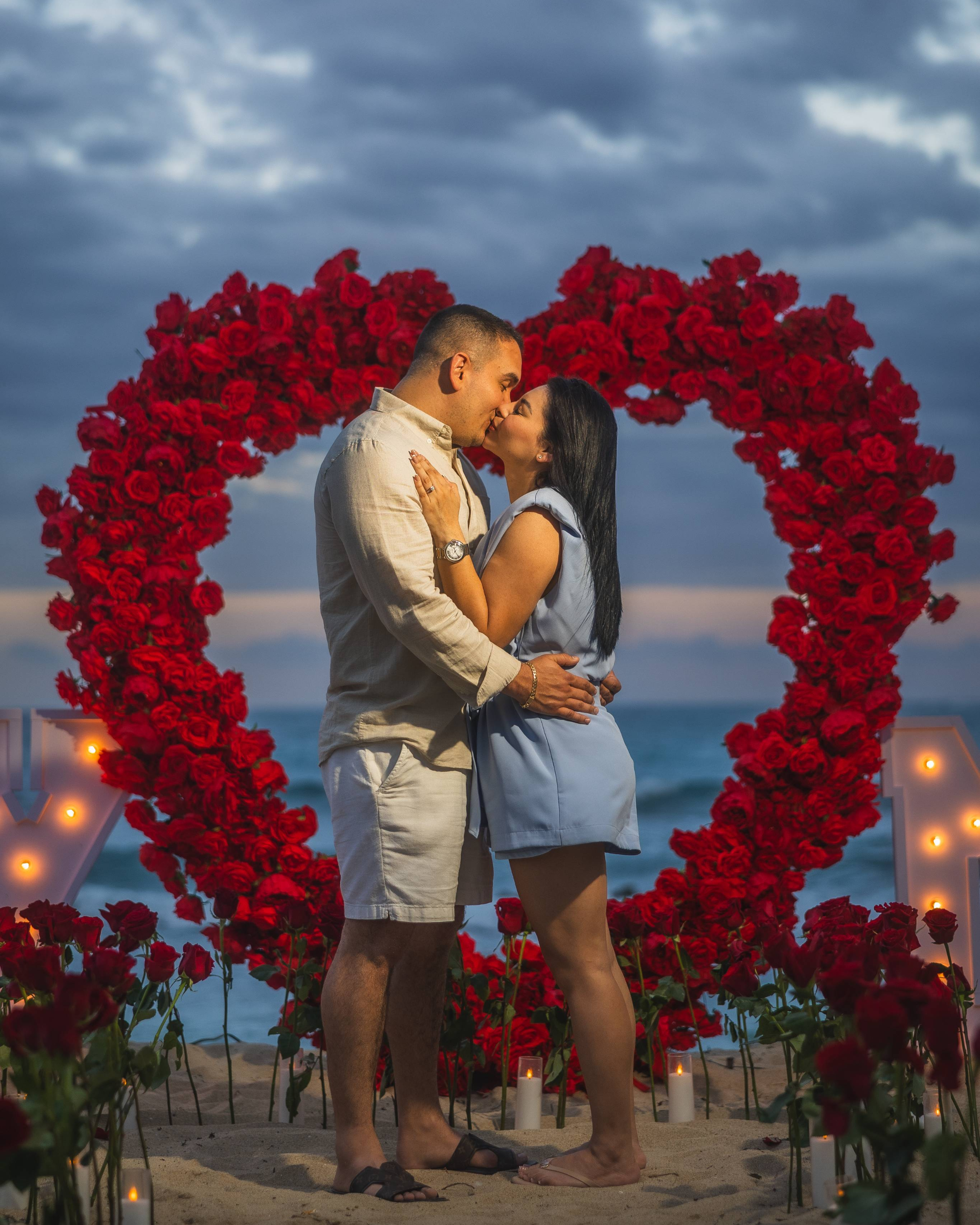 Mexican couple celebrating engagement during a beach marriage proposal in Puerto Rico.