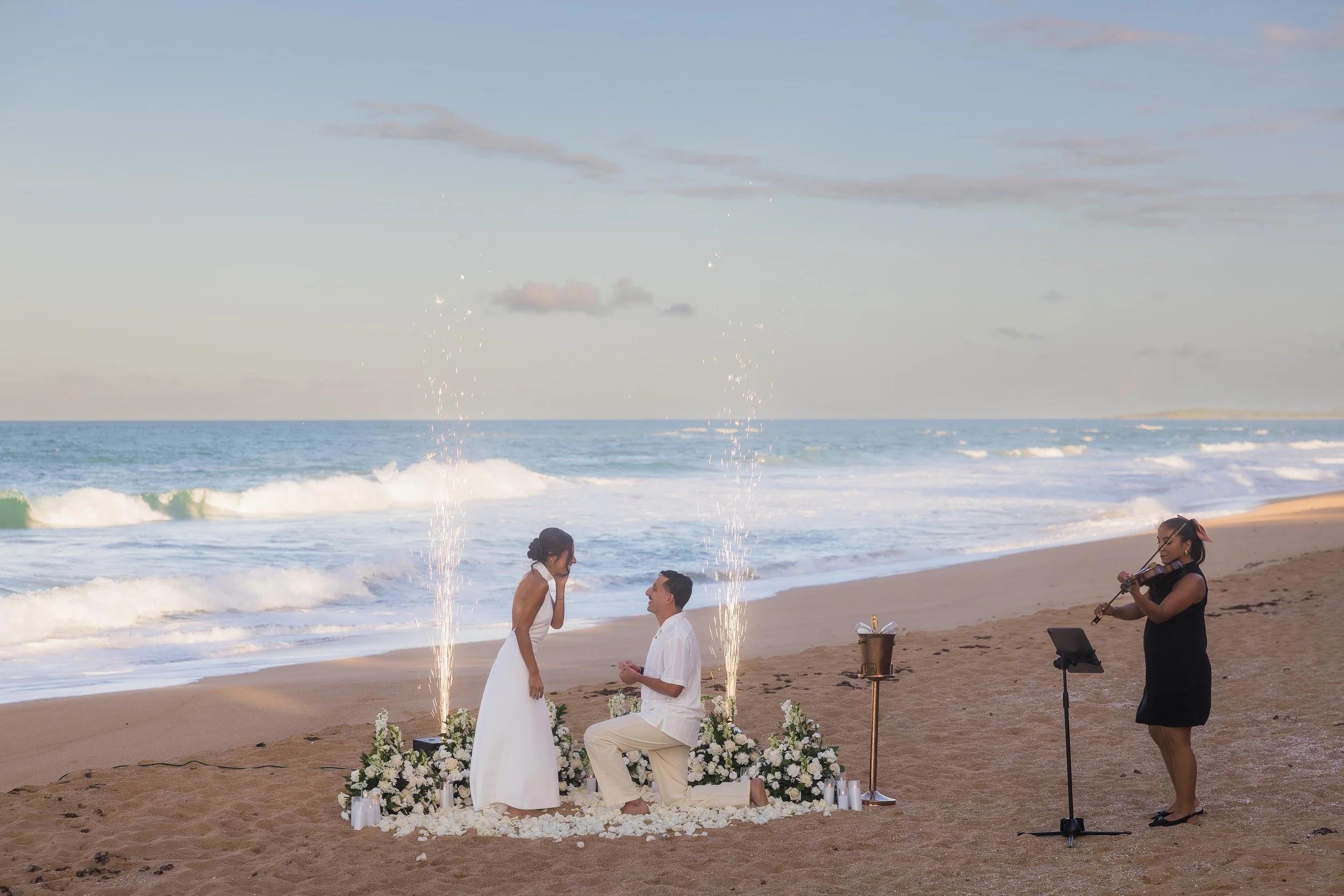 Man proposing marriage at Aviones Beach shot by a wedding photographer in Puerto Rico