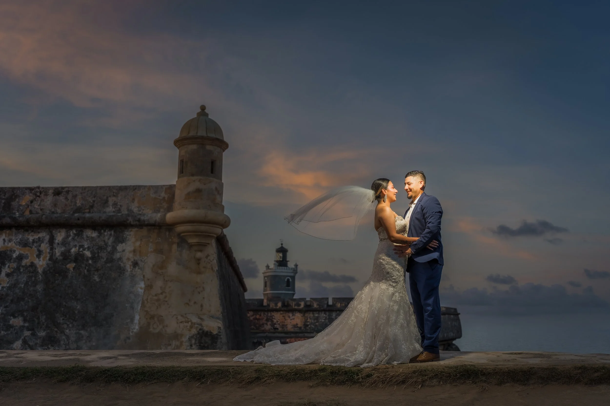 Epic Golden Hour flash portrait of a bride and groom near El Morro in Old San Juan, Puerto Rico during their elopement wedding