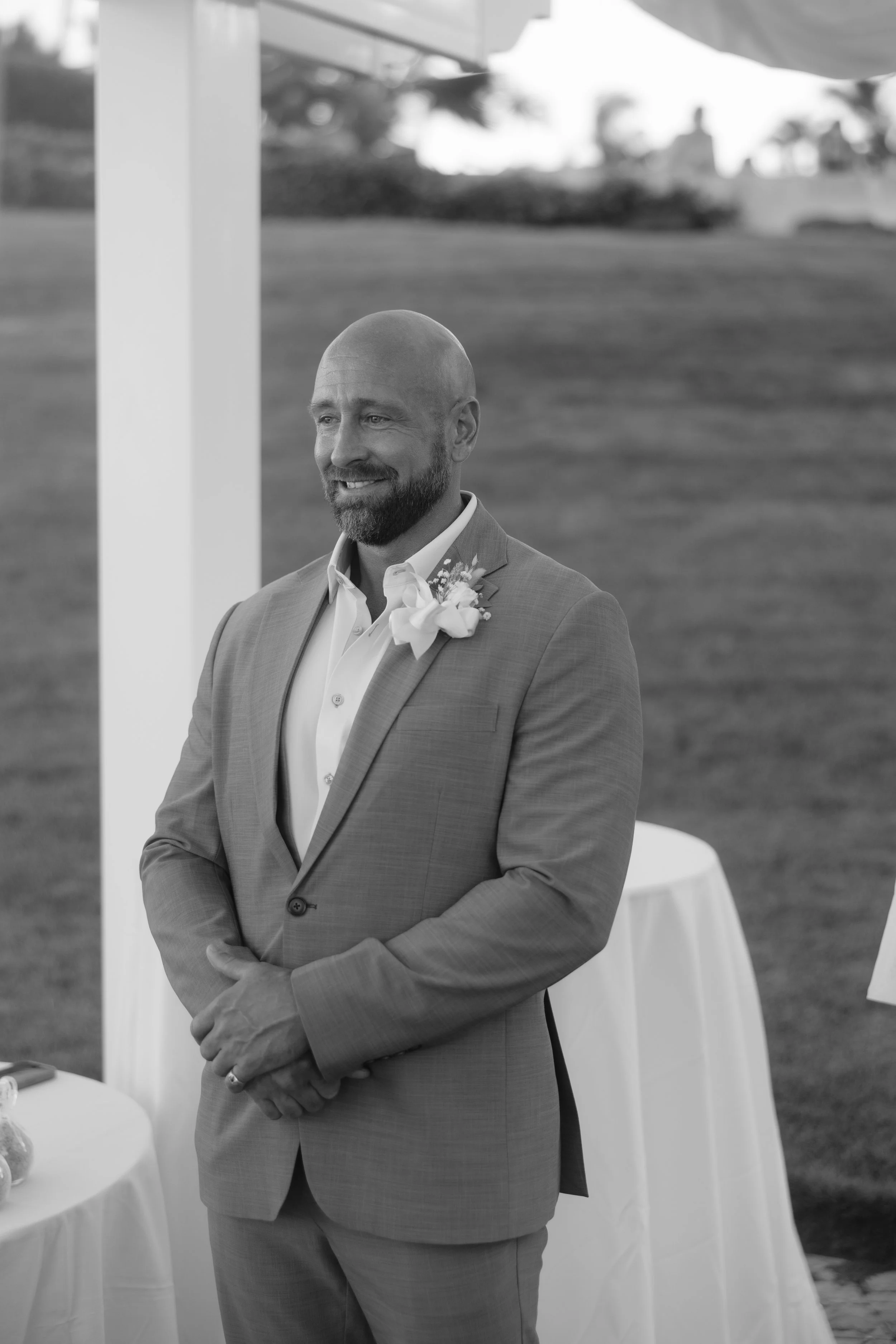 Bride waiting at the archway at El Conquistador Resort shot by an editorial wedding photographer in Puerto Rico