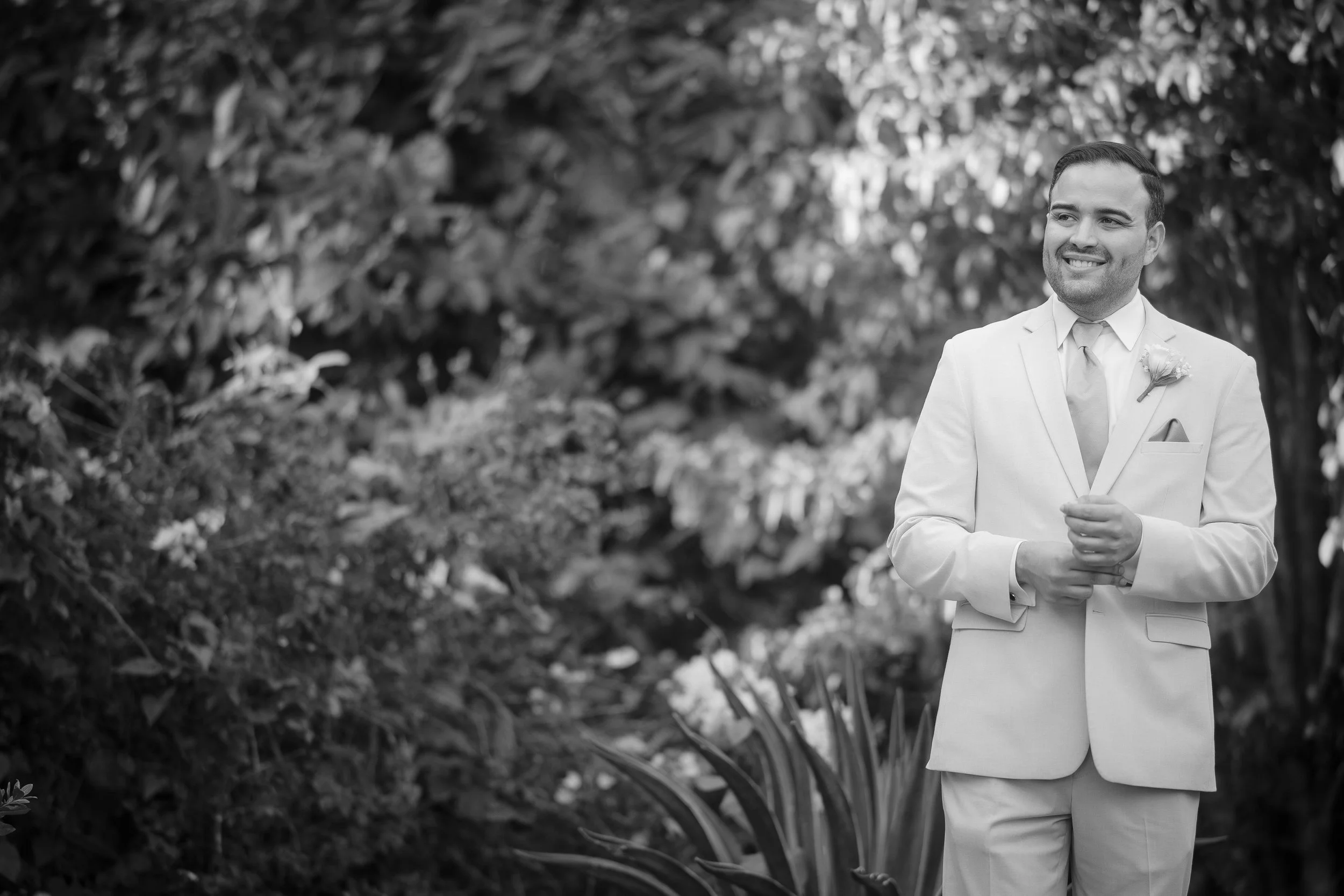 Groom posing at Hacienda Santiago, a wedding venue in Puerto Rico