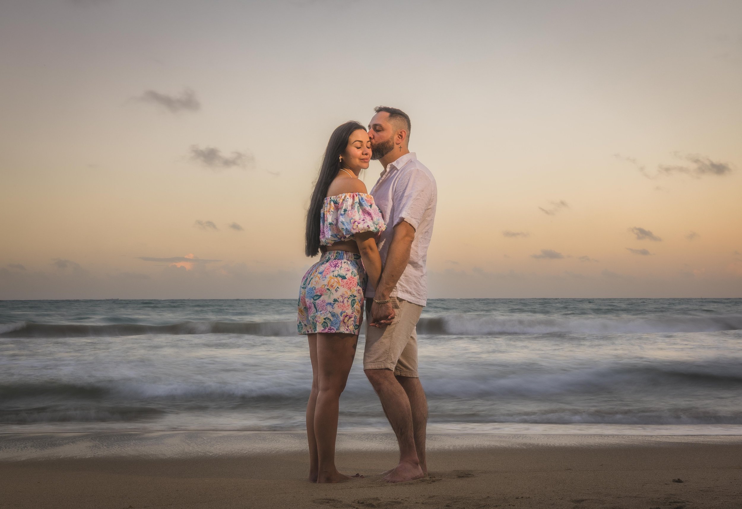 Couple embracing during a marriage proposal in Rincón, Puerto Rico