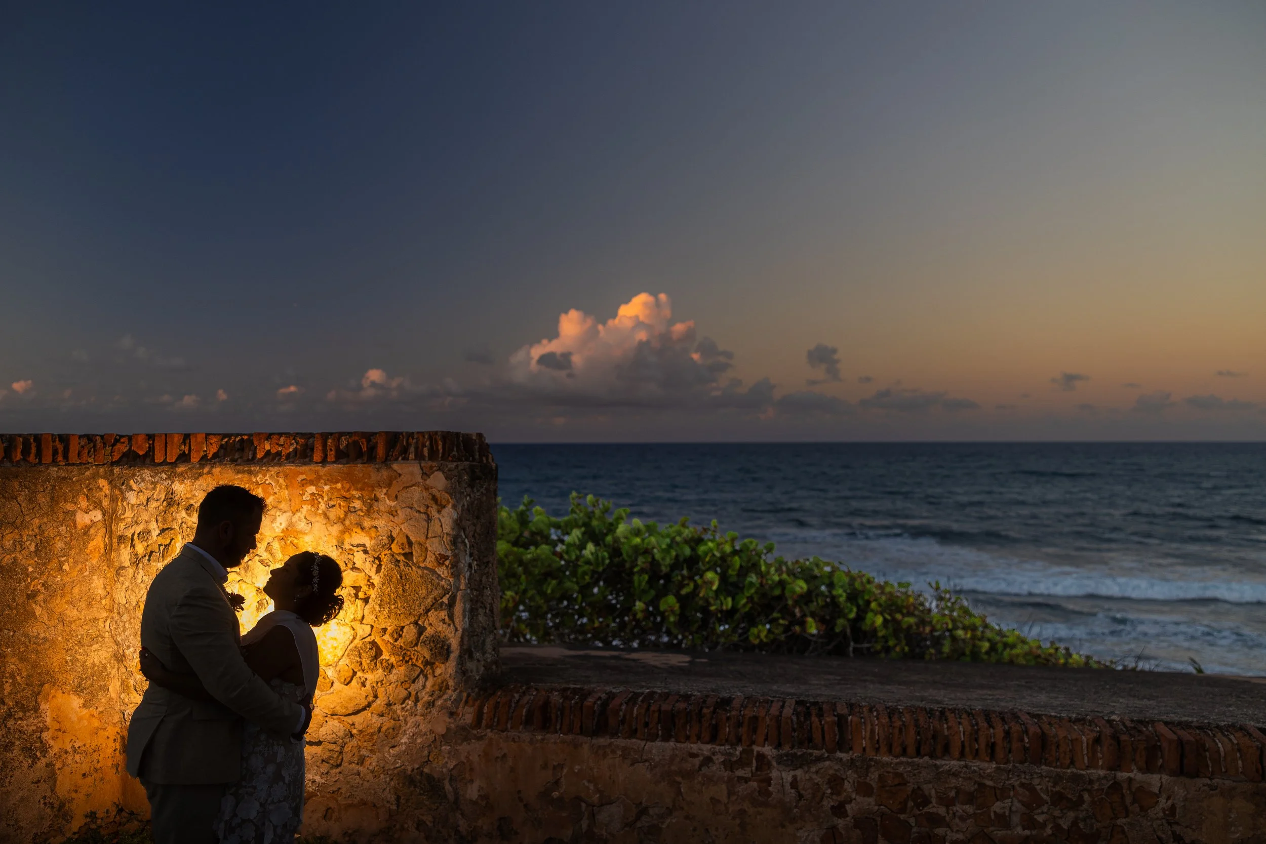 Golden hour portrait of a recently married couple at Escambrón Beach during an elopement in Puerto Rico
