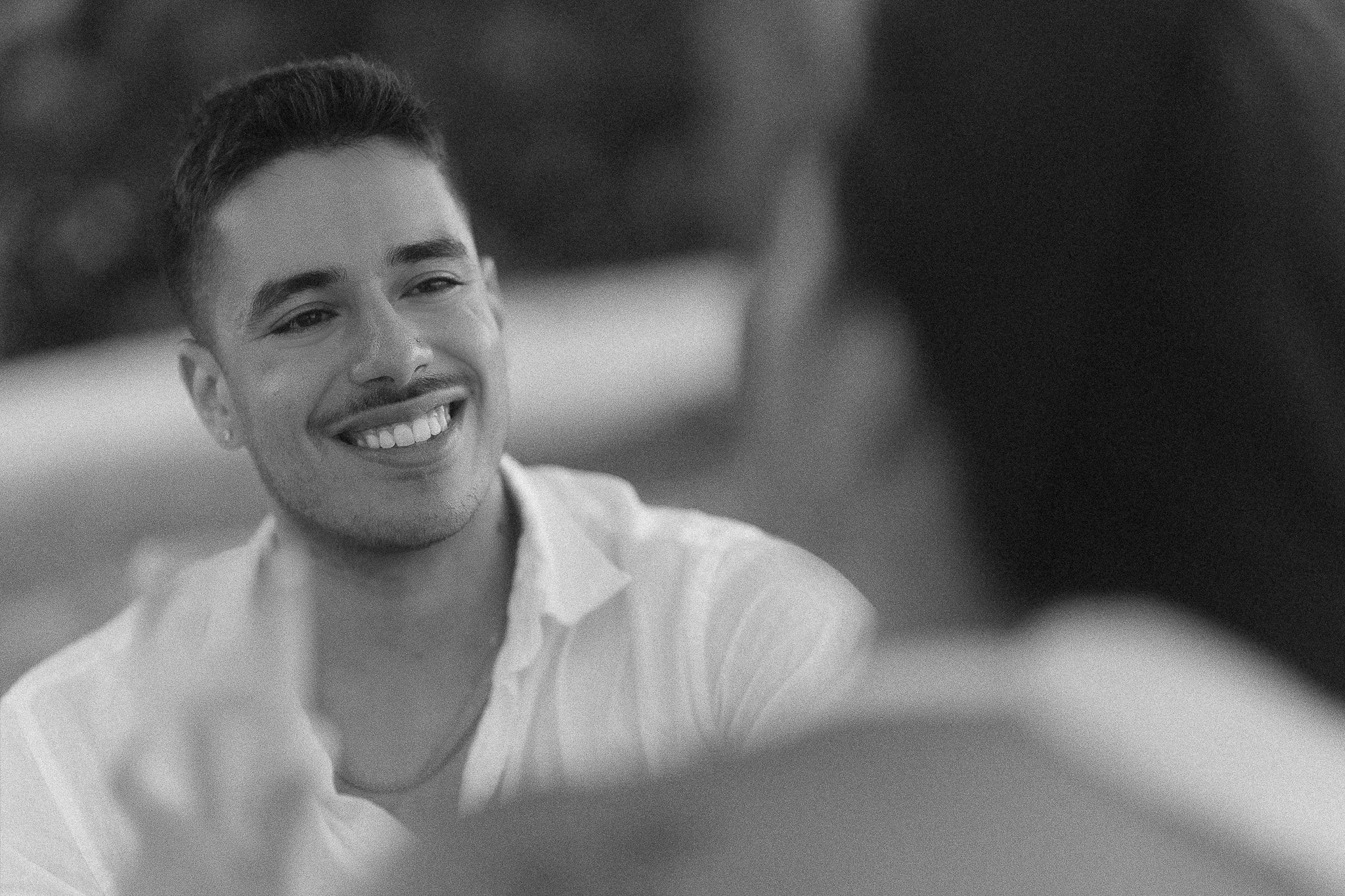 Editorial black and white portrait of a man proposing to a woman during an engagement session in Puerto Rico