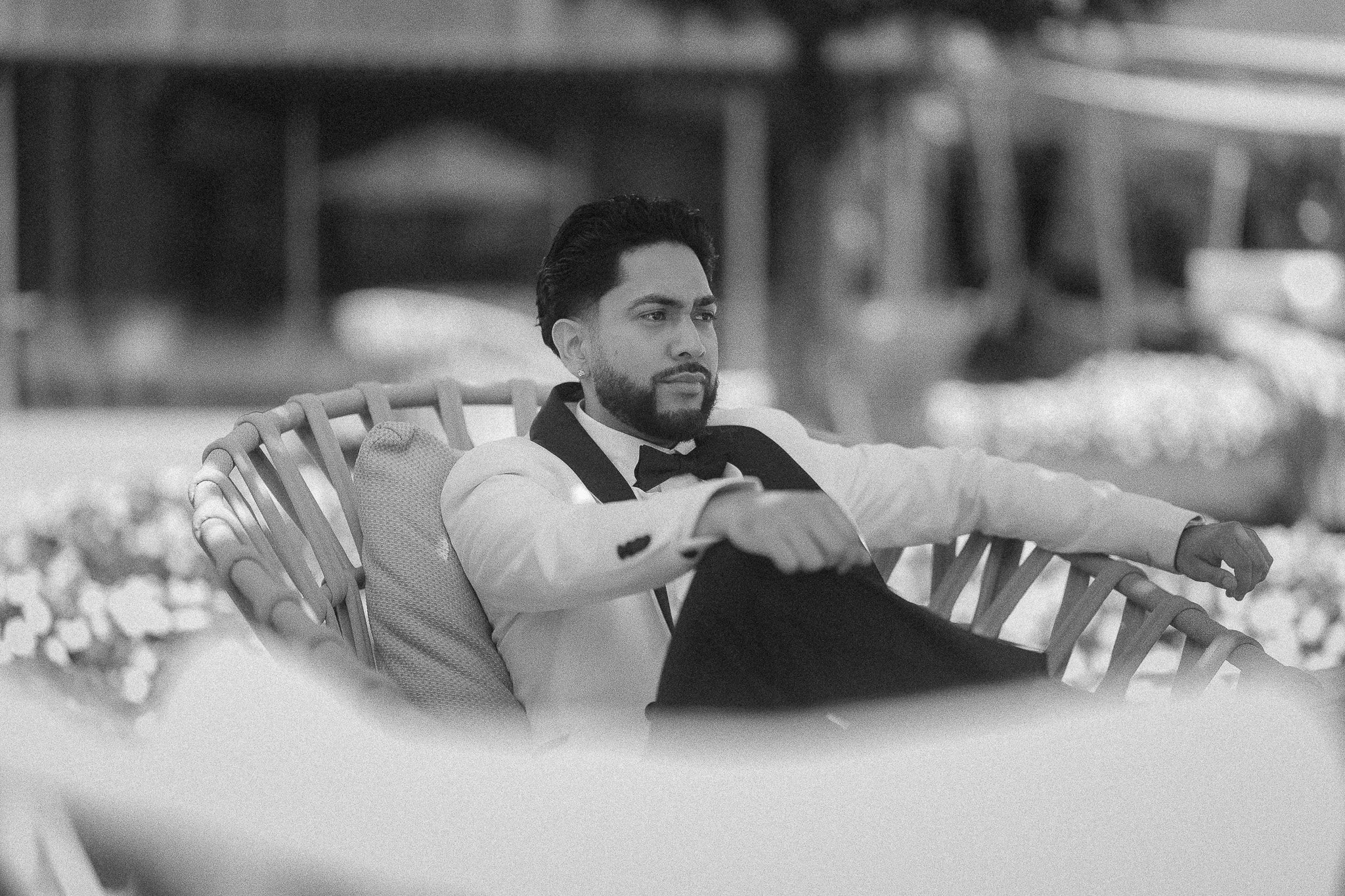 Editorial black and white portrait of a groom at Grand Hotel Victoria in Menaggio, Lake Como, Italy prior to his luxury elopement at Villa del Balbianello taken by a destination wedding photographer
