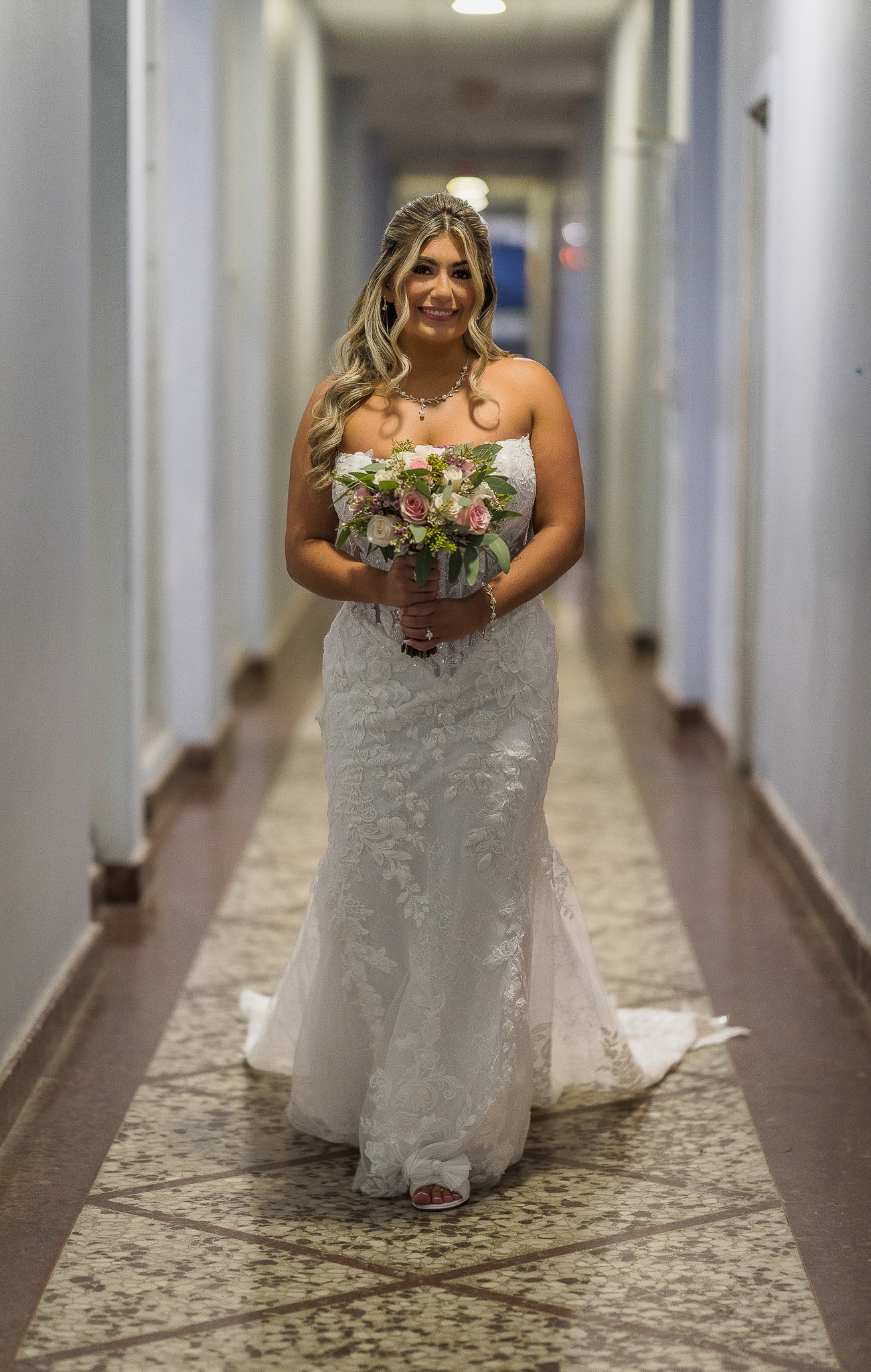 Bride walking down the aisle to her elopement wedding in Puerto Rico at Condado del Mar