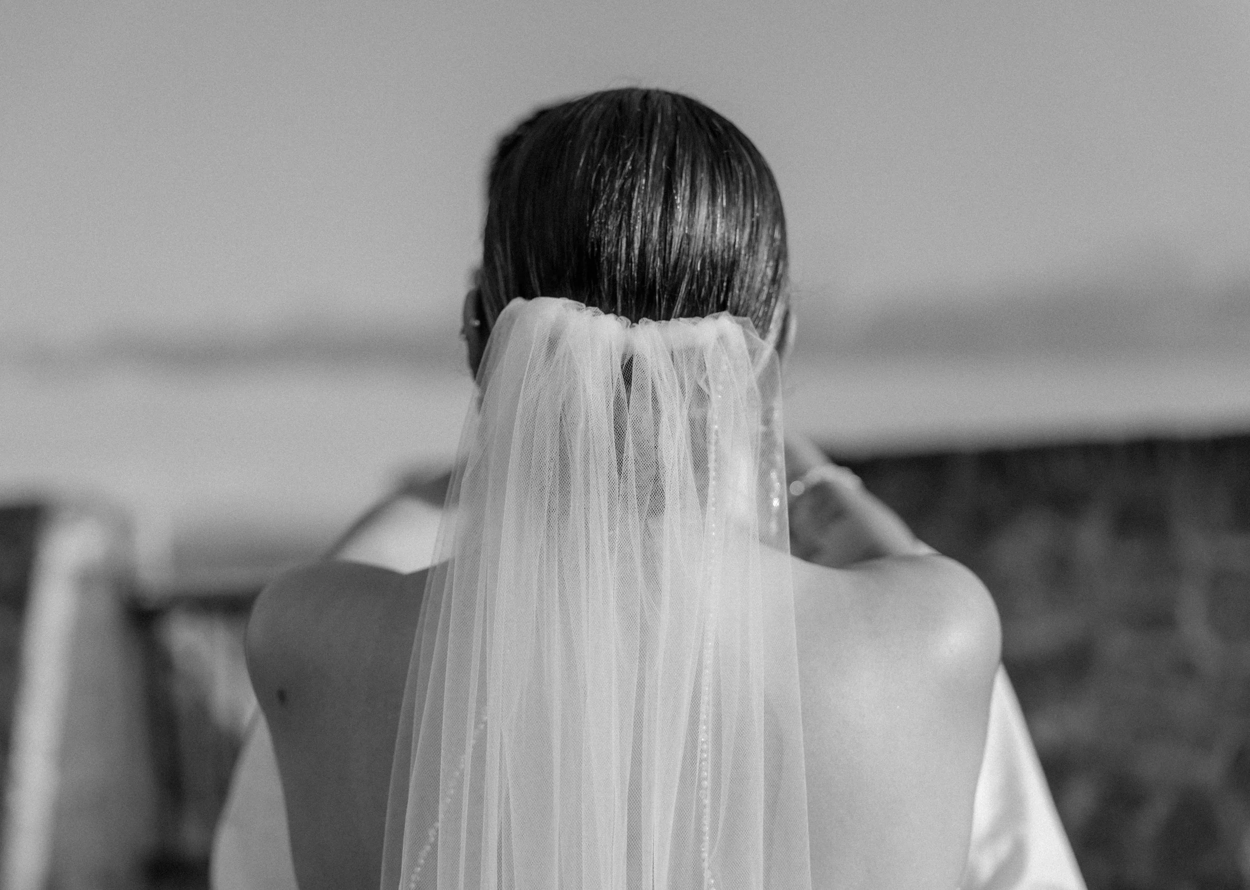 A bride's veil shot from behind by a luxury wedding photographer during an intimate elopement in Old San Juan, Puerto Rico