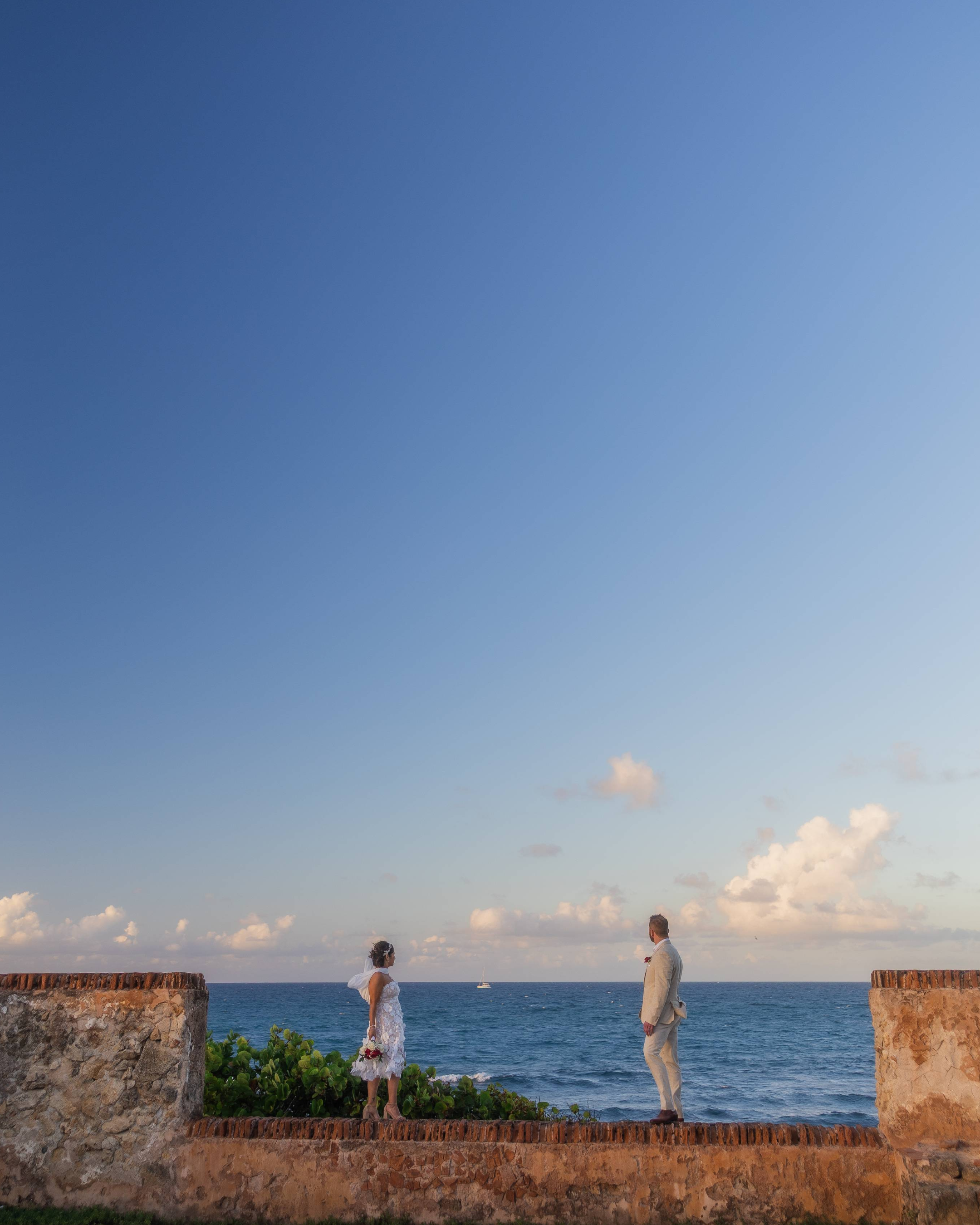 Couple embracing during a sunset elopement at Escambrón Beach in Puerto Rico