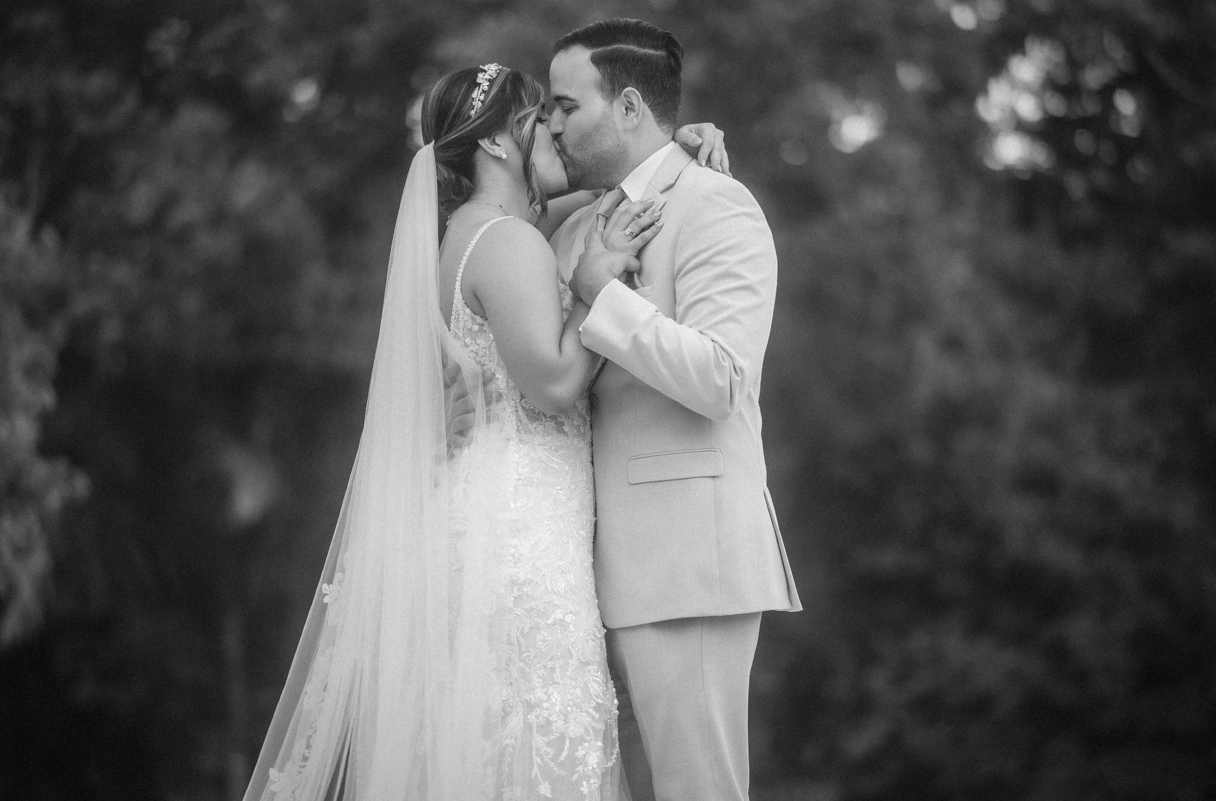 First kiss during wedding ceremony at Hacienda Santiago, a wedding venue in Puerto Rico