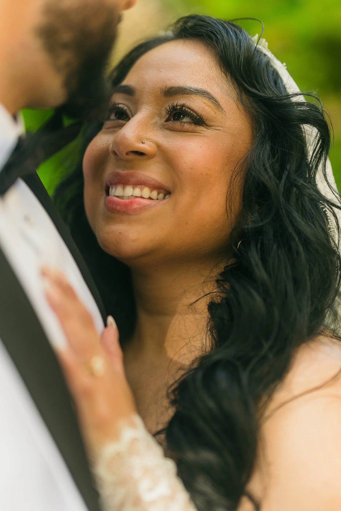 Bride embracing groom during their luxury elopement at the Villa del Balbianello wedding venue shot by a photographer in Lake Como, Italy