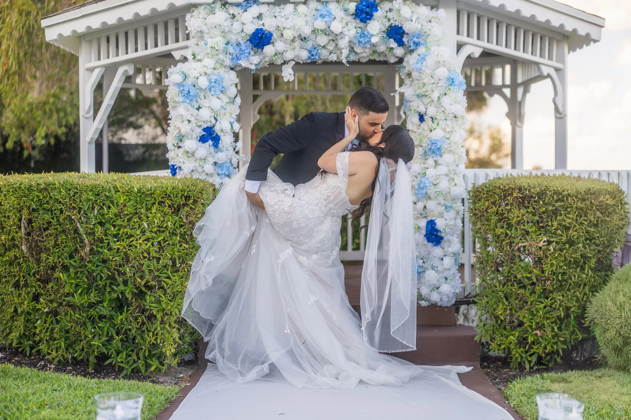 Bride and groom during the first kiss at Indian Spring Country Club in Boynton Beach, Florida
