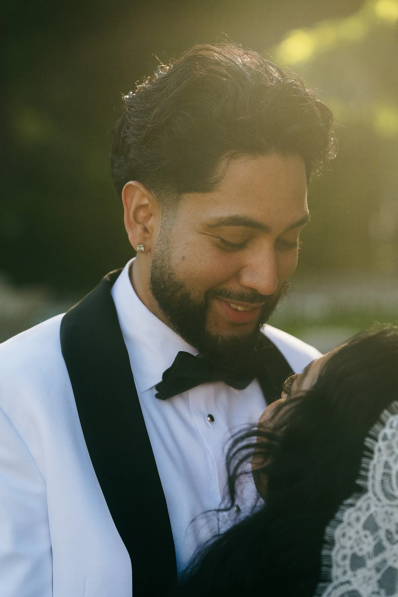 Groom smiling at bride during their elopement wedding at Villa del Balbianello in Lake Como, italy
