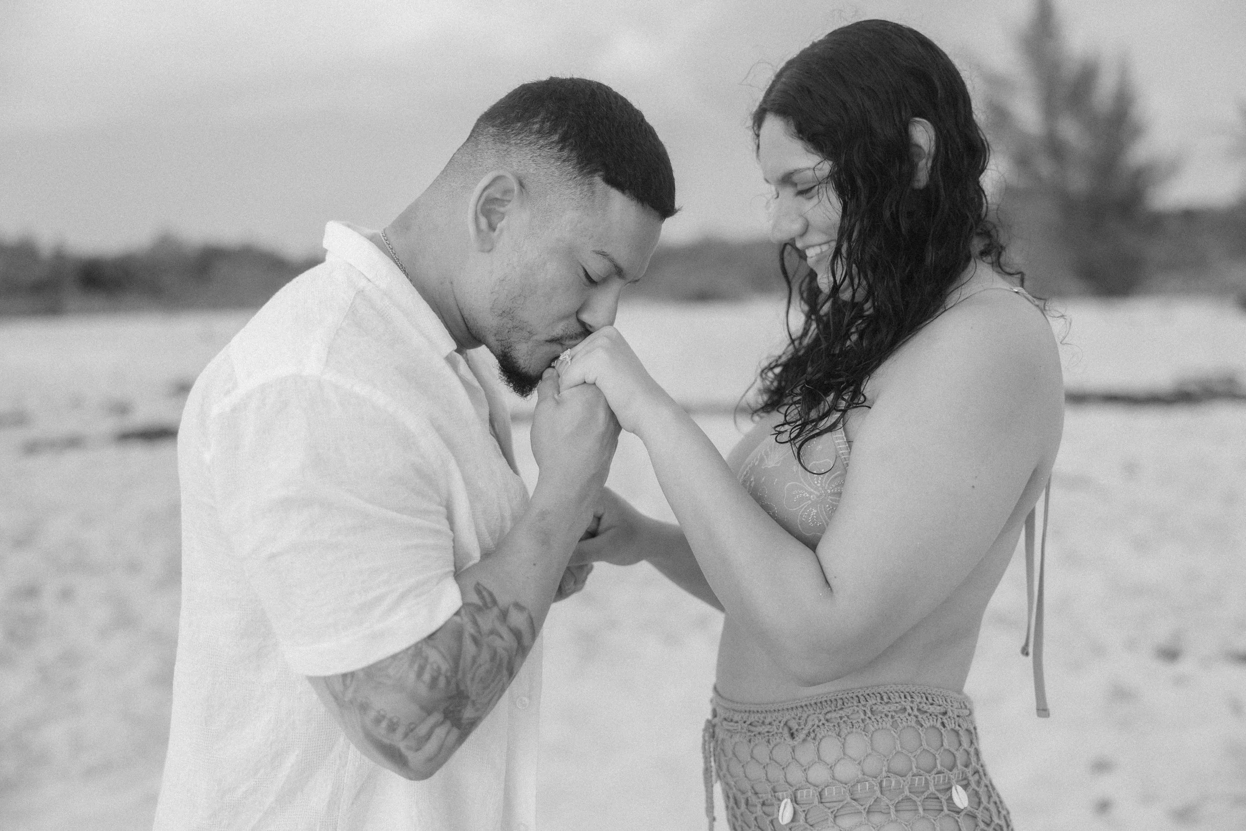 Newly engaged couple embracing during golden hour in Puerto Rico