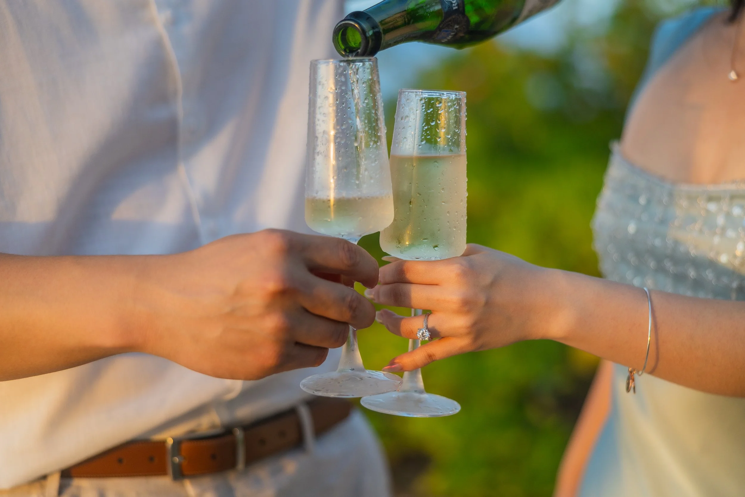 Champagne flutes holding win during a luxury marriage proposal at the Hyatt Regency Grand Reserve in Puerto Rico