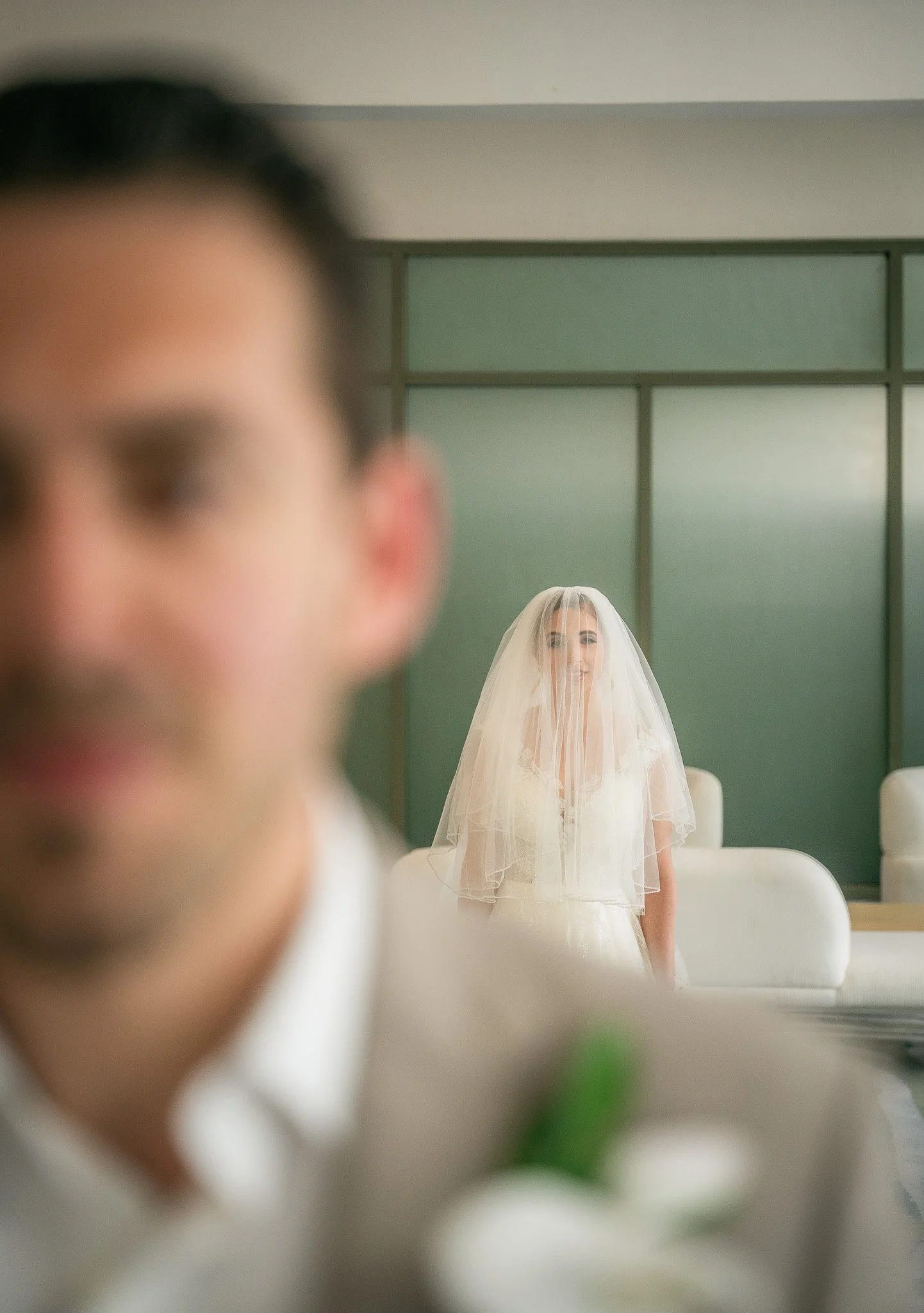 Bride seeing groom at La Concha Renaissance Hotel shot by a luxury wedding photographer in Puerto Rico