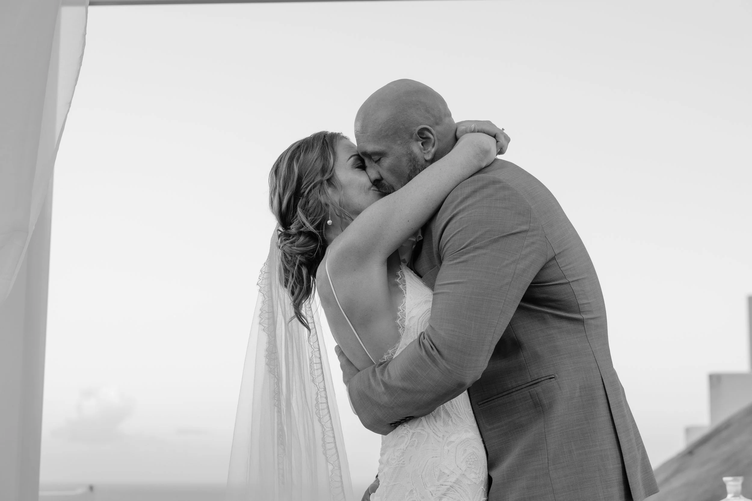 First kiss at El Conquistador Resort during a luxury wedding taken by a Puerto Rico editorial photographer