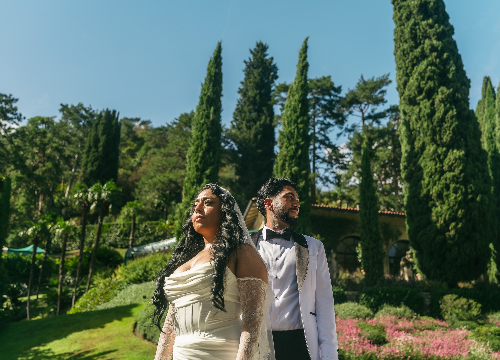 Bride and groom posing at Villa del Balbianello, a luxury wedding venue in Lake Como, Italy shot by a destination wedding photographer