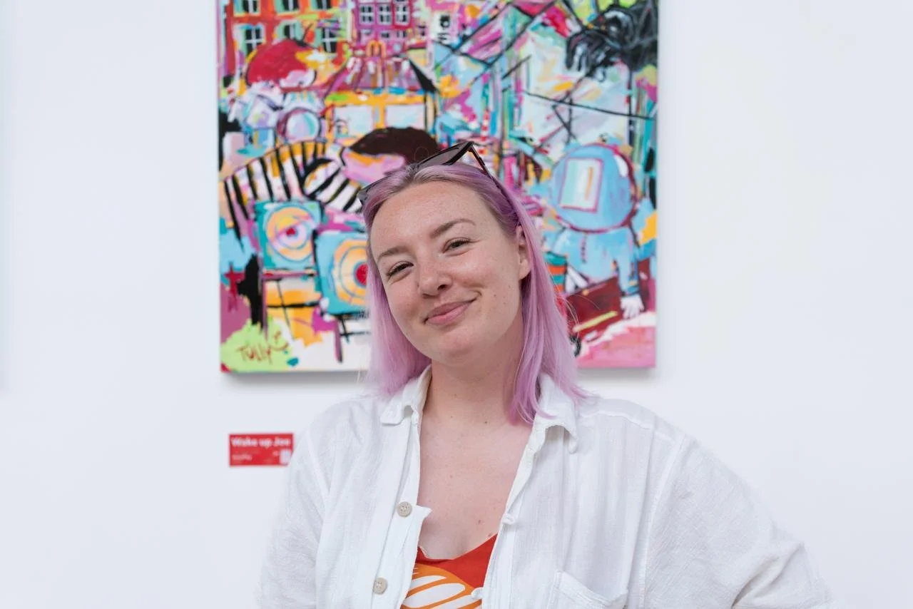Zoe in front of Joe Tully art in the LWG