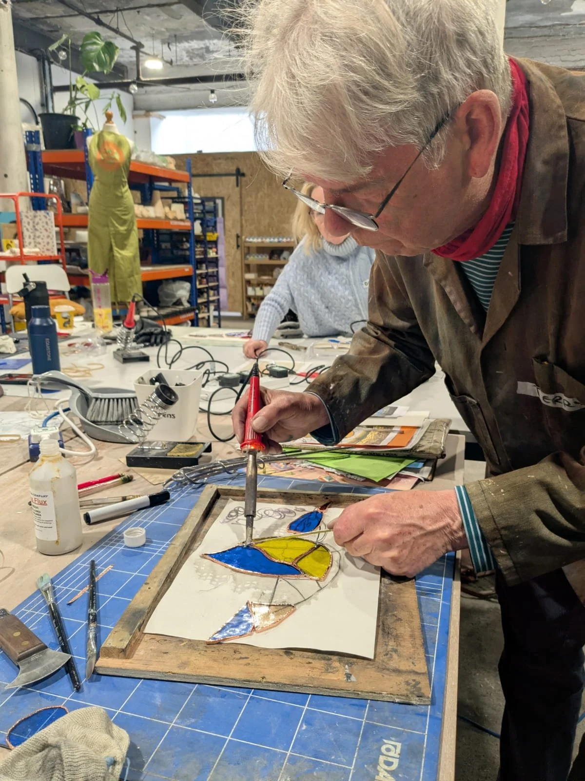 Image of fused glass arch with rabbit in a field