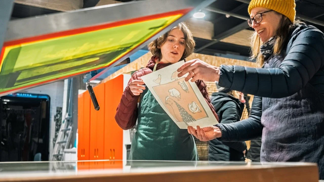 Image of a silk screen with a hand drawn image ready to be printed with blue ink