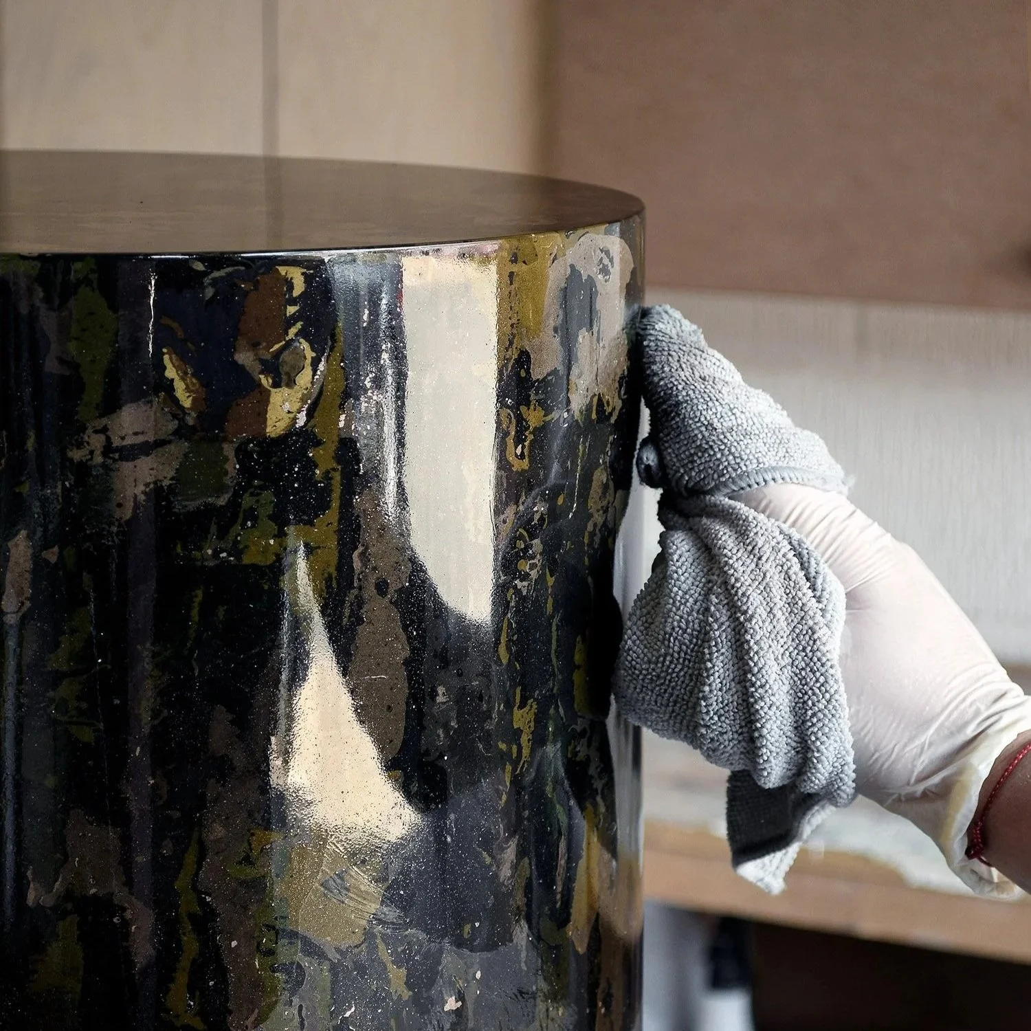 Applying natural oils to scagliola side table