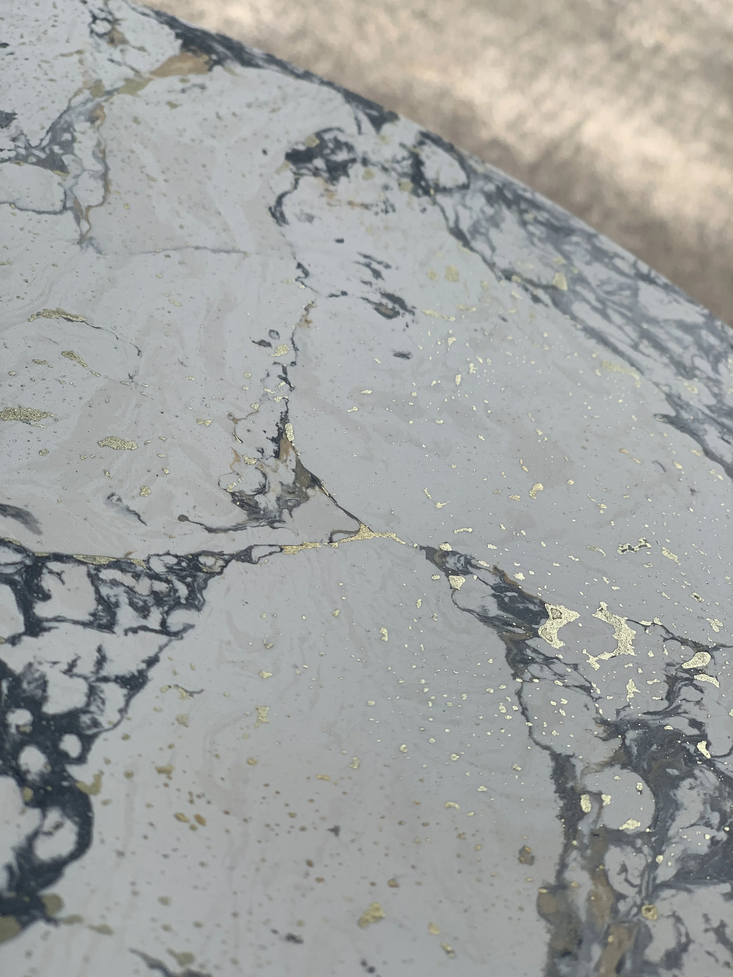 liquid resin highlights on scagliola table