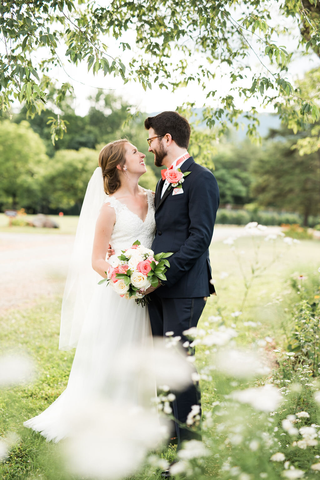 bride and groom portrait with flowers framing the photo