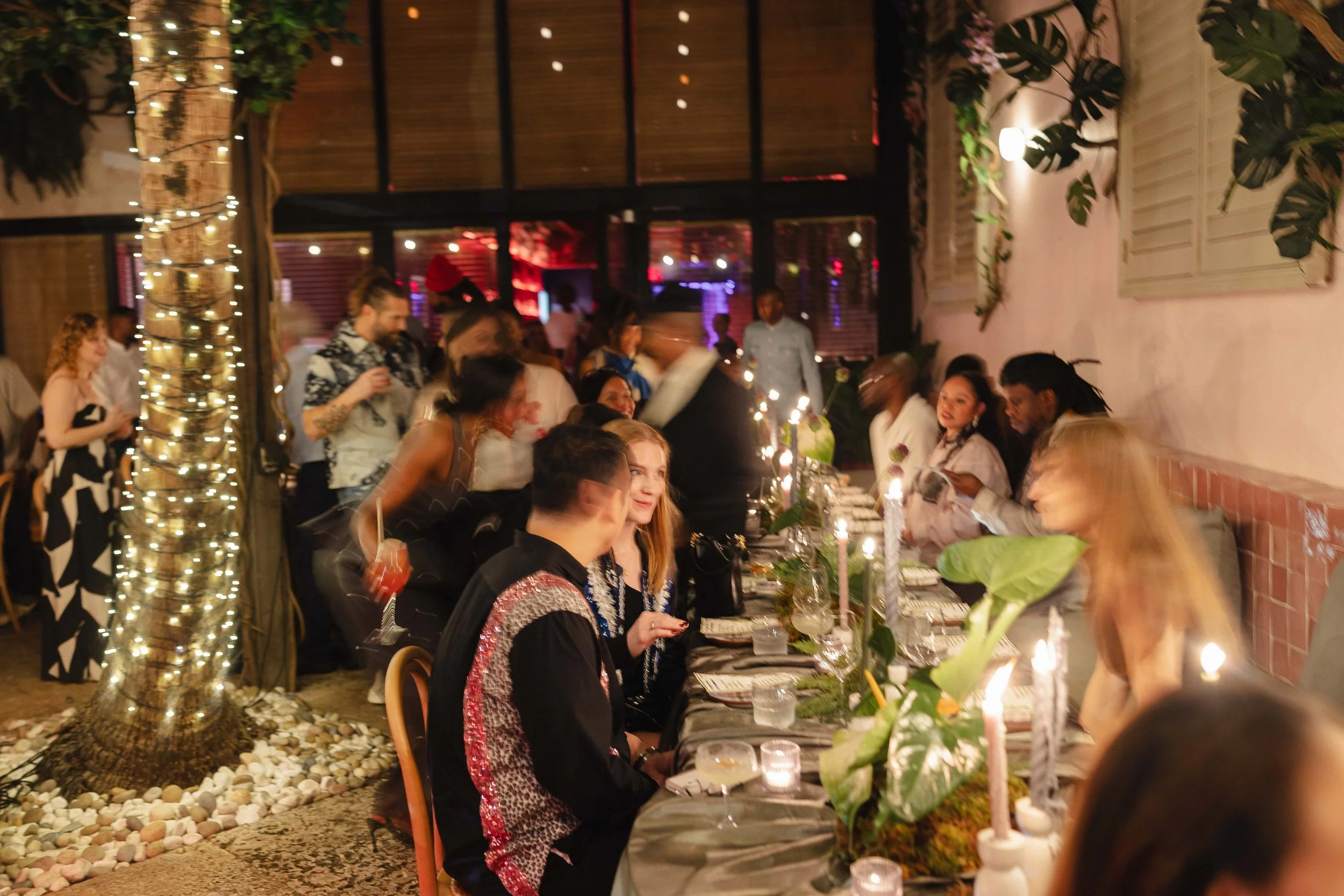 Art Basel Miami Beach dinner and salon at Las' Lap for Alahna Jade, Steelo Brim, Jack Shainman Gallery, and Louis XIII, produced with tropical florals, candlelight, and a curated guest experience.