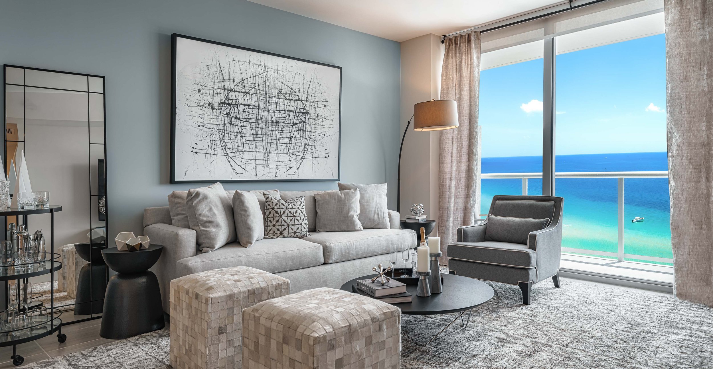 Interior photo of condo living room with beach view.