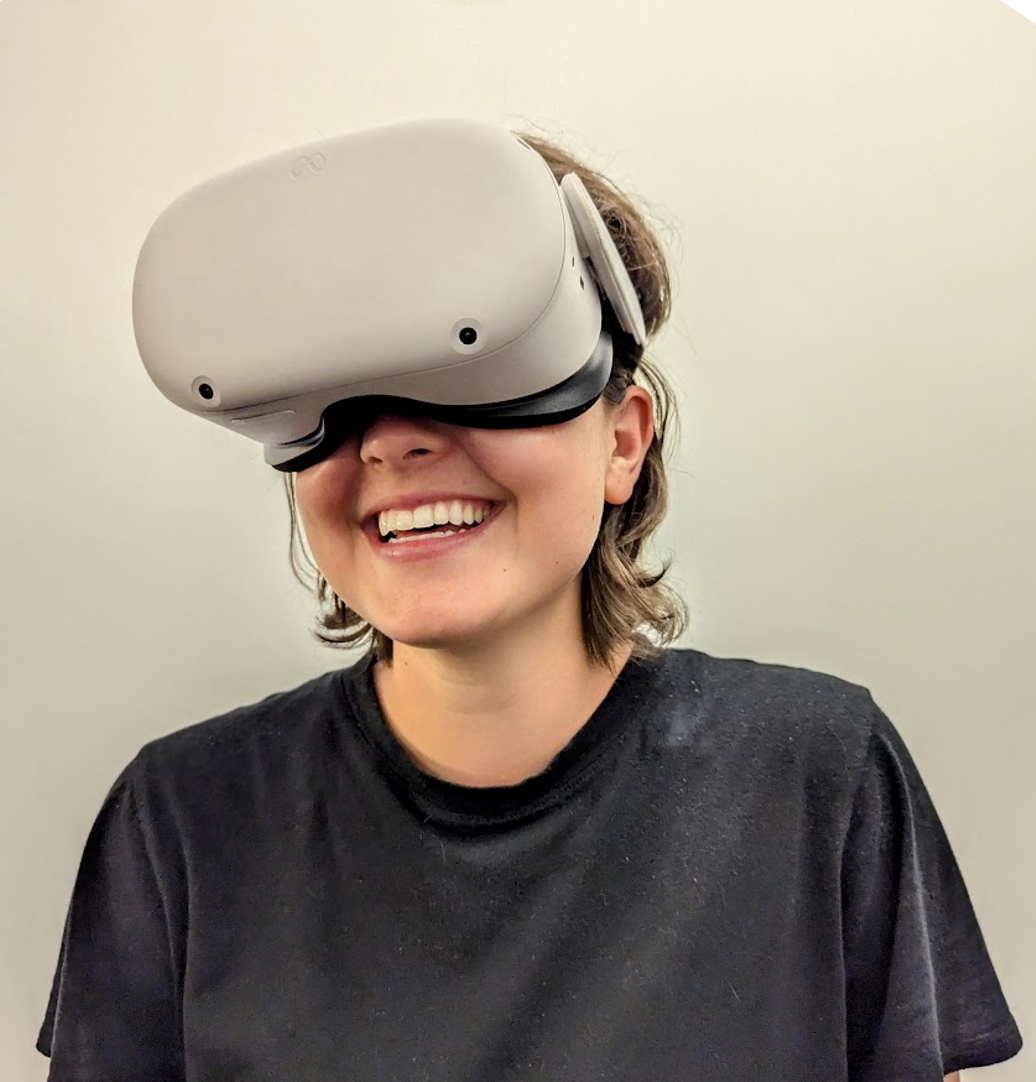 Clinical Research Coordinator Francesca de Marneffe testing out a virtual reality headset. 