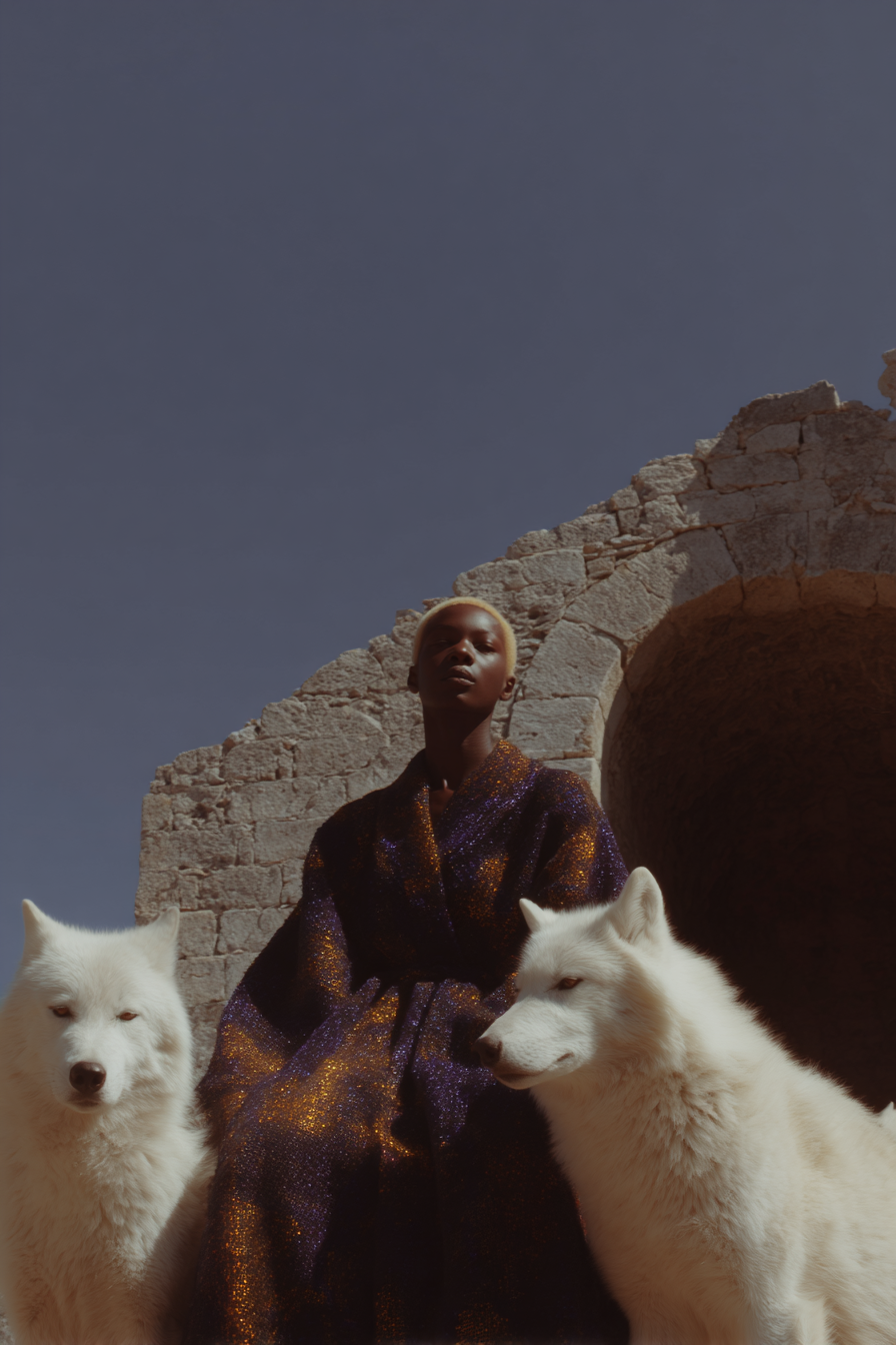 Fashion_African_female_model_seated_in_a_massive_stone_cathed_2a361080-7f83-4812-8024-8e974fbb76d5_1.png