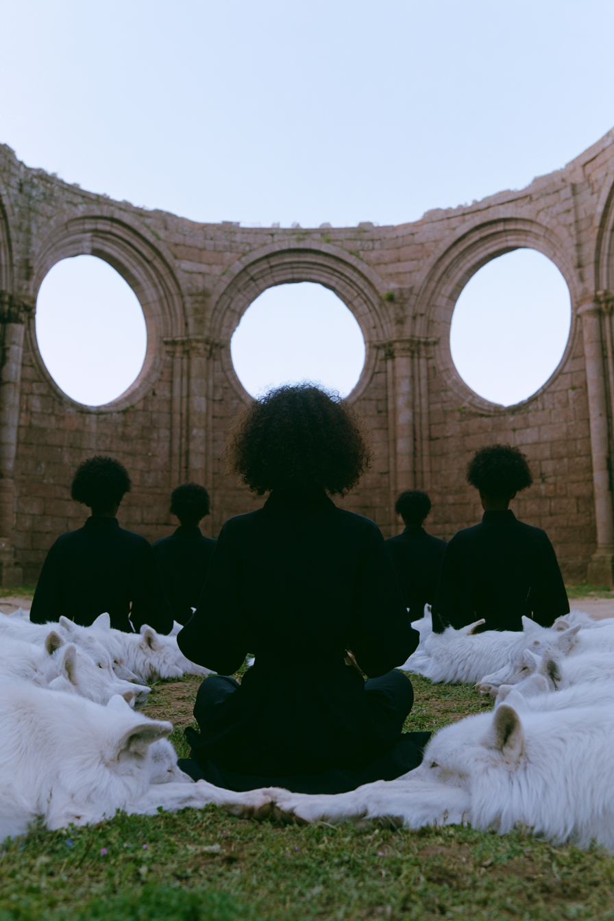 Fashion_African_female_model_seated_in_a_massive_stone_cathed_070faa18-b011-4d7f-b365-667640a898f1_2.png