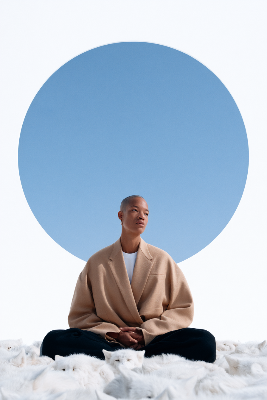 Fashion_African_female_model_seated_in_a_massive_stone_cathed_71e25d35-b628-4f2f-a8d7-3a17a9095e6f_3.png