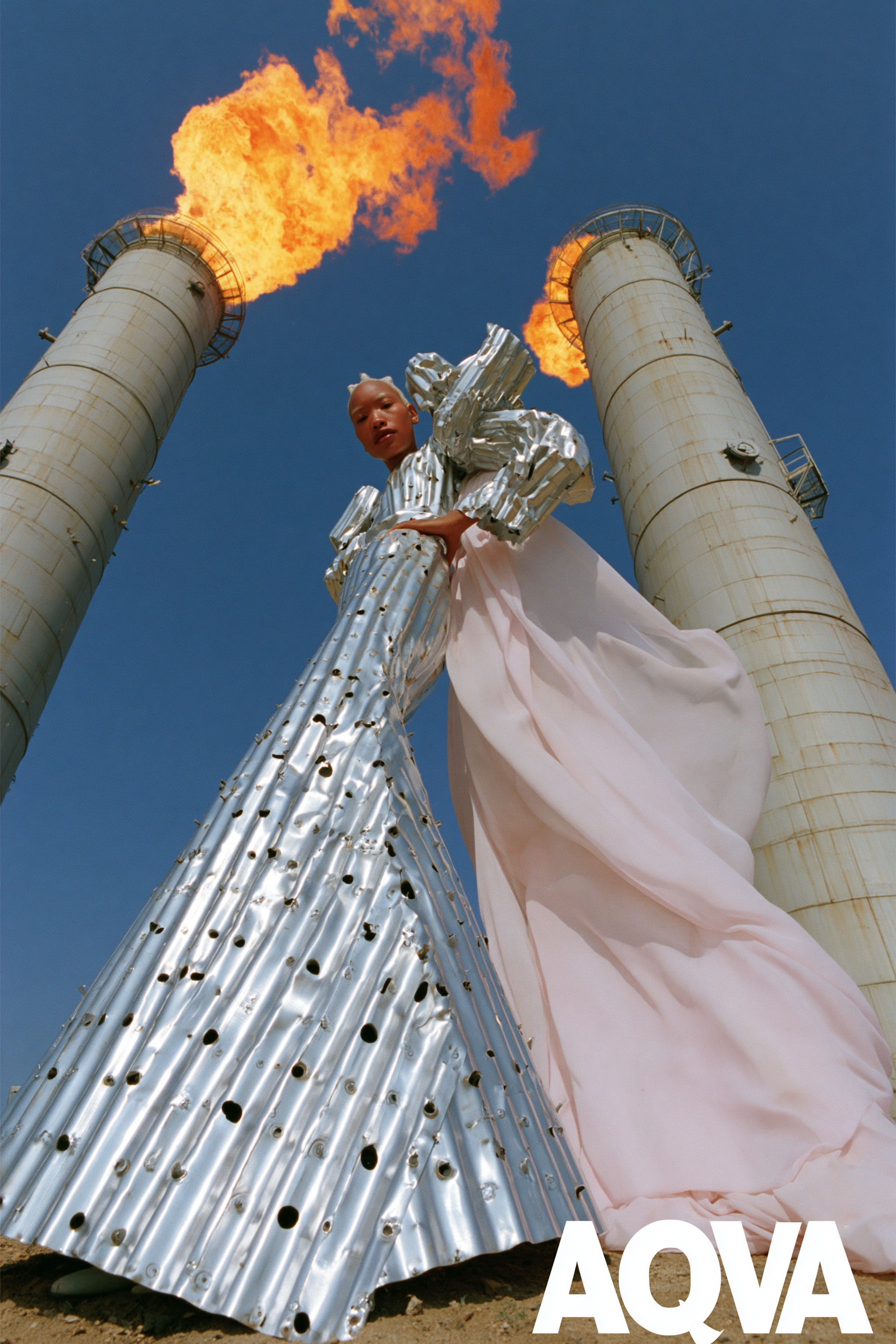 African_female_model_wearing_an_architectural_gown_of_corruga_9e6852c5-d0d1-4a73-9a97-35bf9d9e53b3_2.png