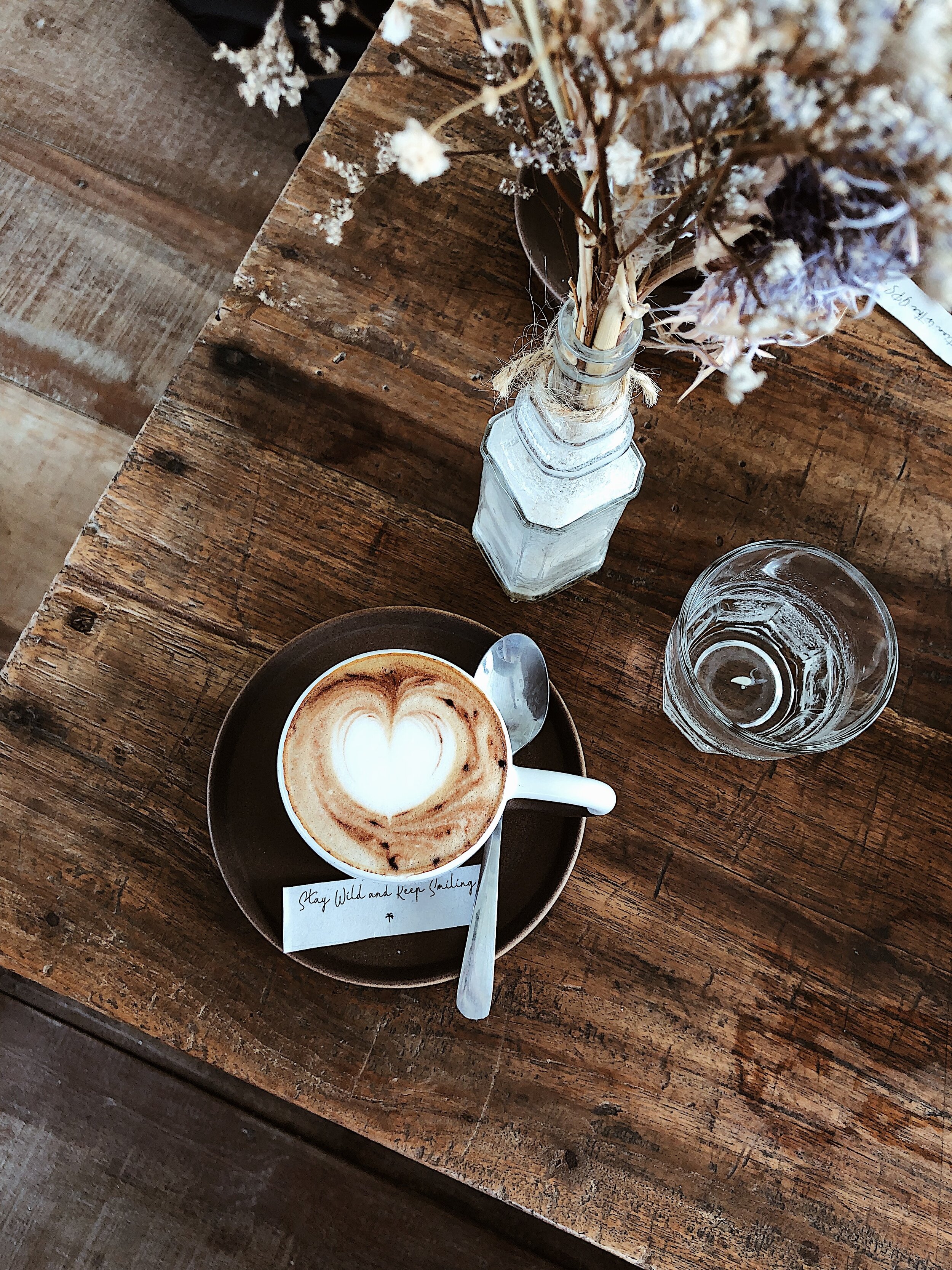 white-ceramic-mug-on-black-saucer-next-to-glass-of-water-2897695.jpg