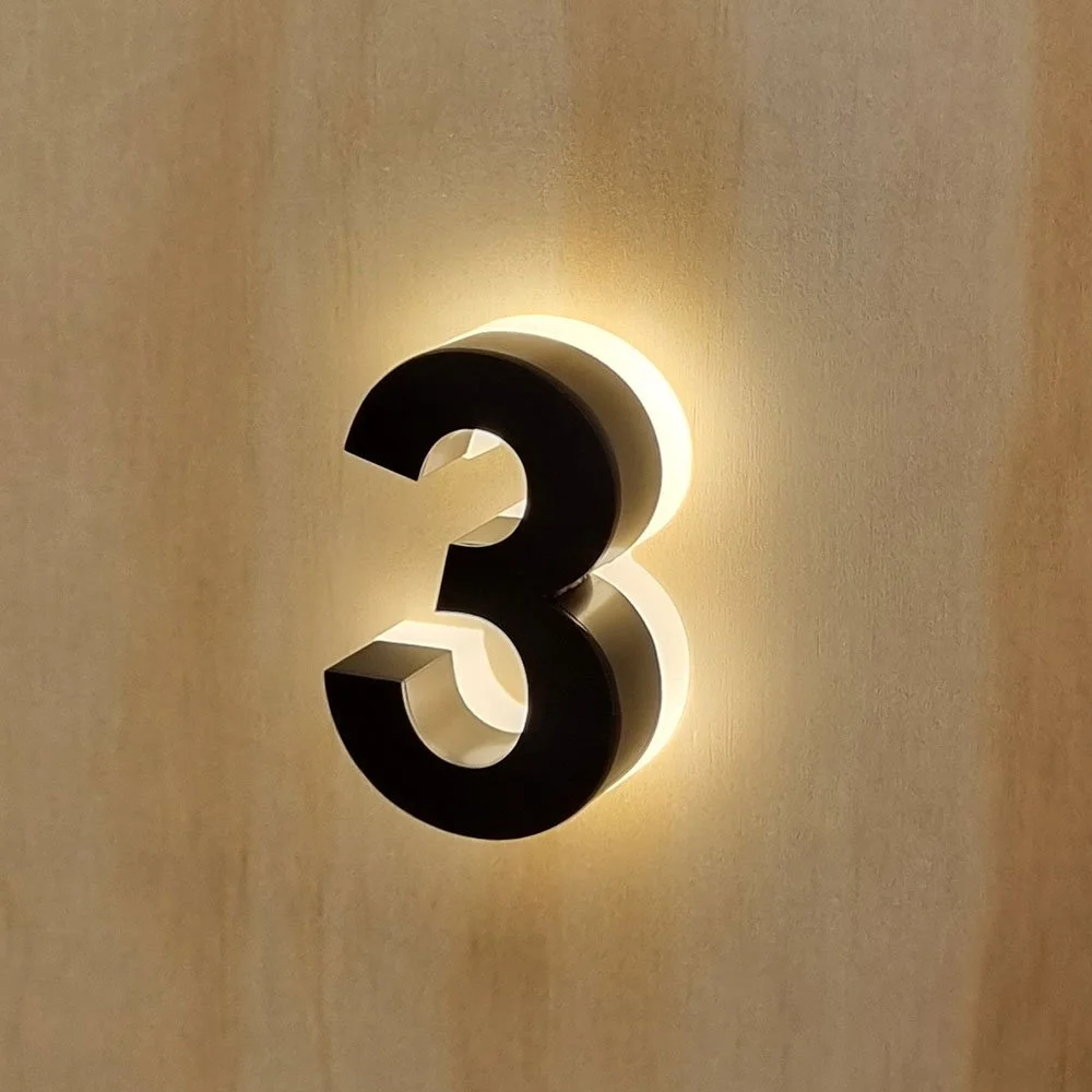 Backlit halo-illuminated LED house number in Black Brushed metal 7cm size