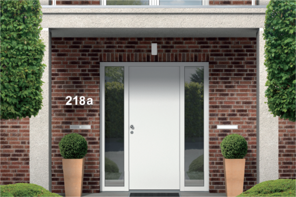 LED illuminated house numbers installed onto a house front wall