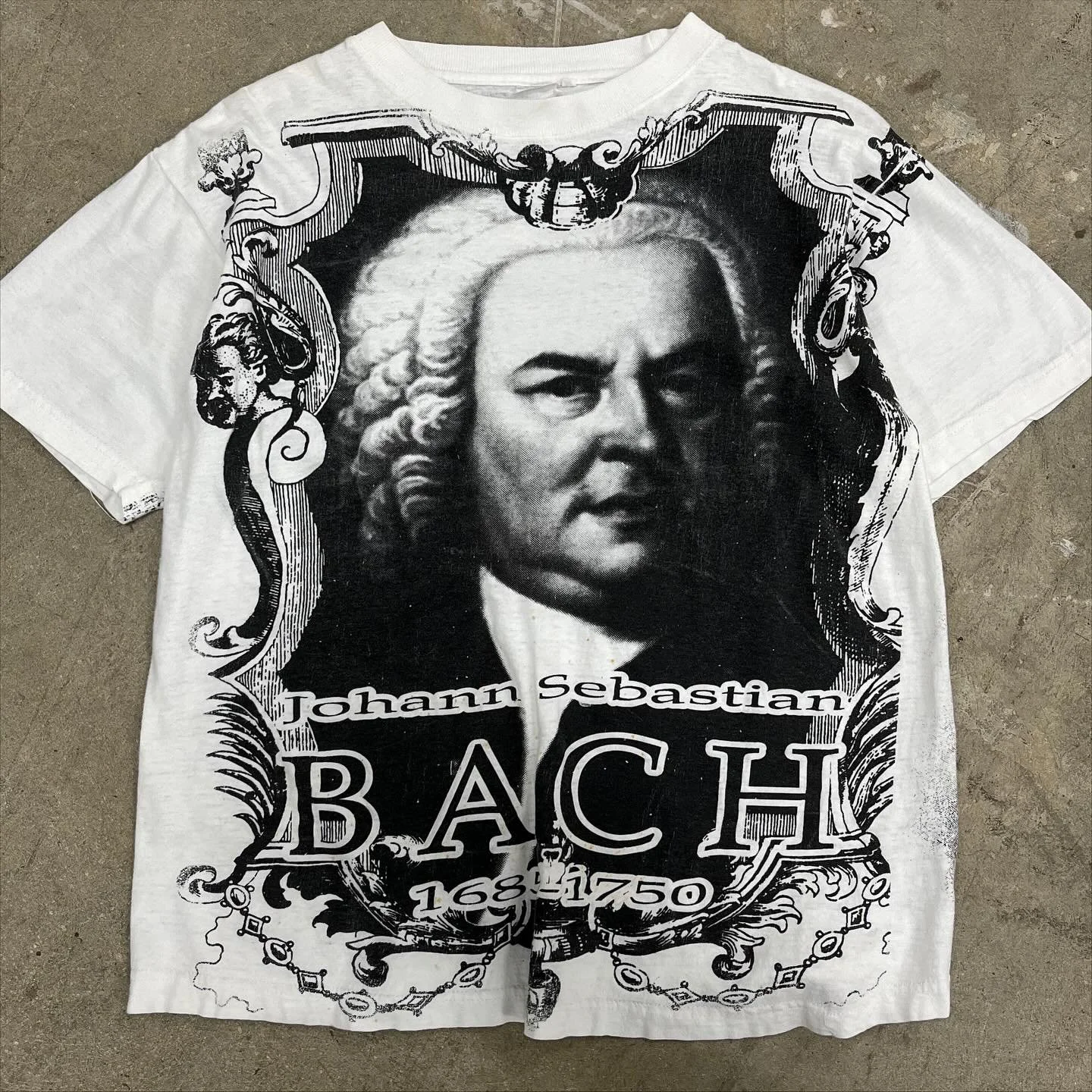 💚 Vintage Bach AOP tee 
.
Composed 1000+ pieces of music.
Had 20 kids.
Prolific.
.
$45 + ship
DM to purchase
All proceeds go to @dcabortionfund -  they help provide abortion access to those in need.
.
Medium
Pit-to-Pit = 21
Length = 27
.
___________