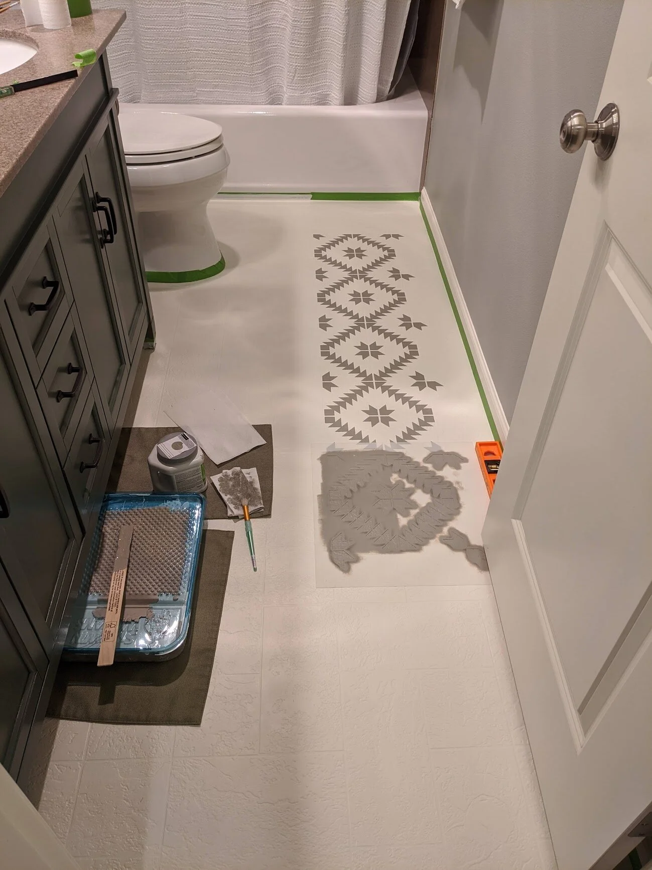 painting tile stencil on bathroom floor