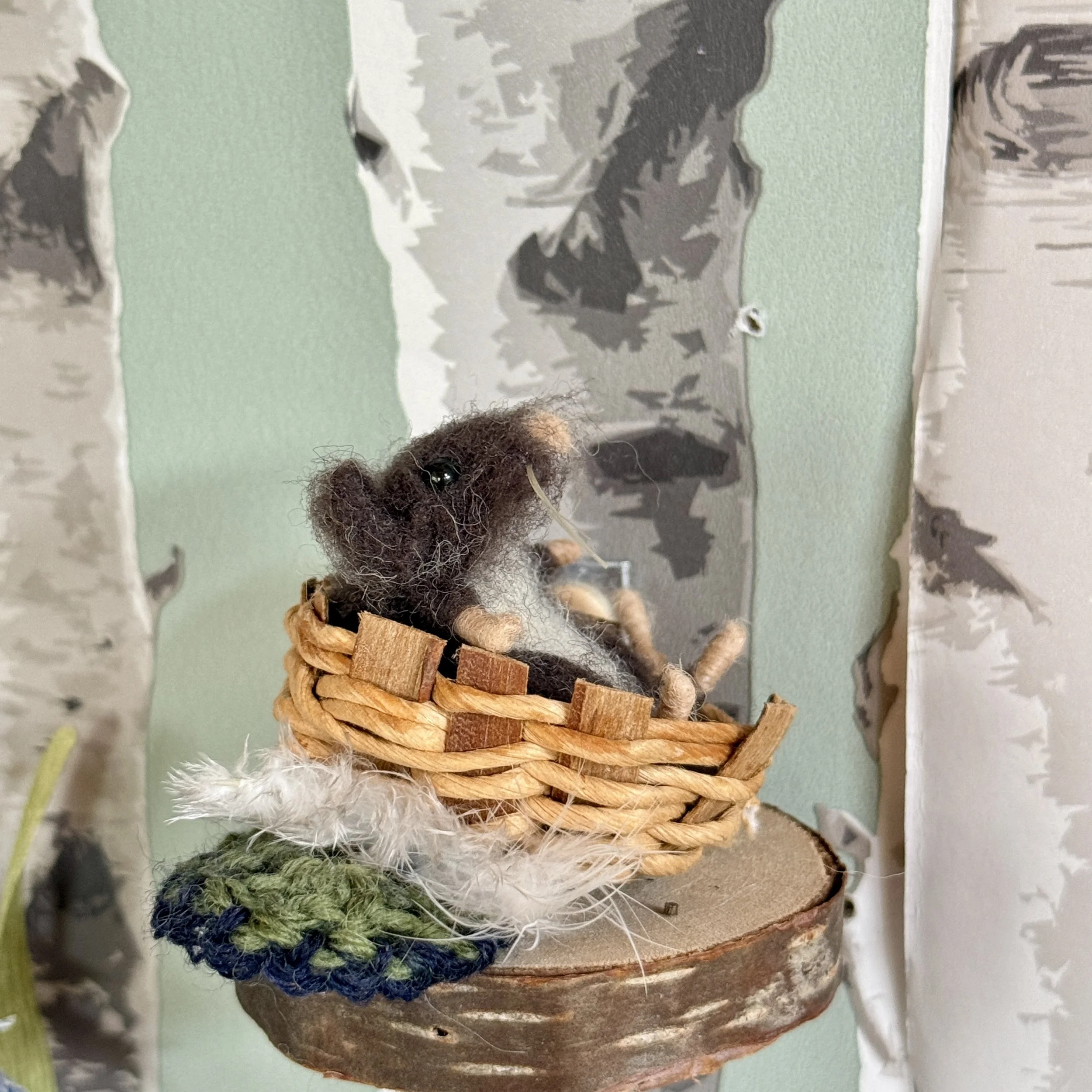 Old shrew gathered feathers to tickle the baby's tears away. Tiny baby shrew in a tiny basket with a tiny feather. approx 5cm long £130