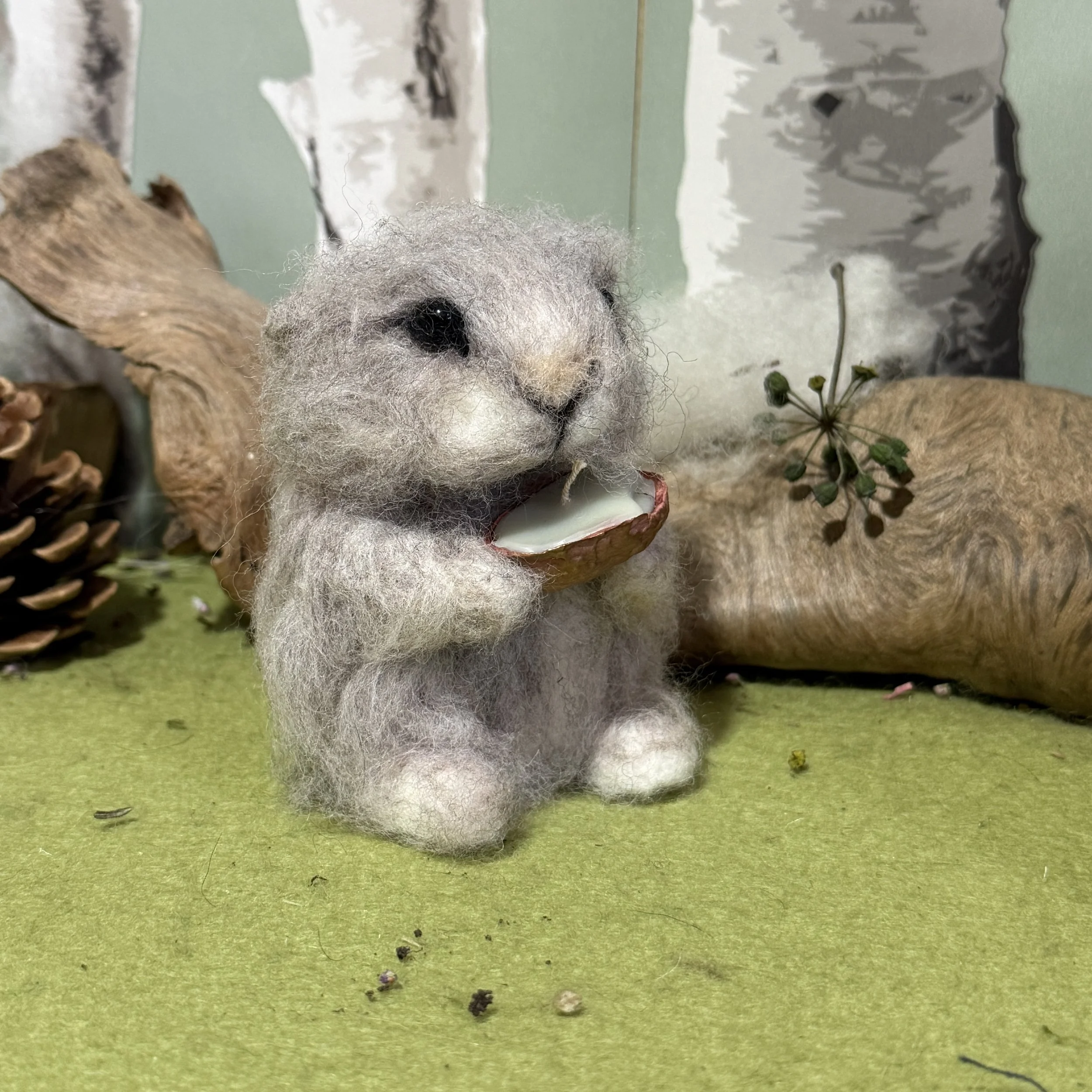 Arctic Lemming from the Northlands with a copper cast of a walnut shell candle ready to light in the earth to warm it ready for Spring. Lemming is approx 9cm tall and needle felted over a wire armature so can be moved and posed. The candle is pure co