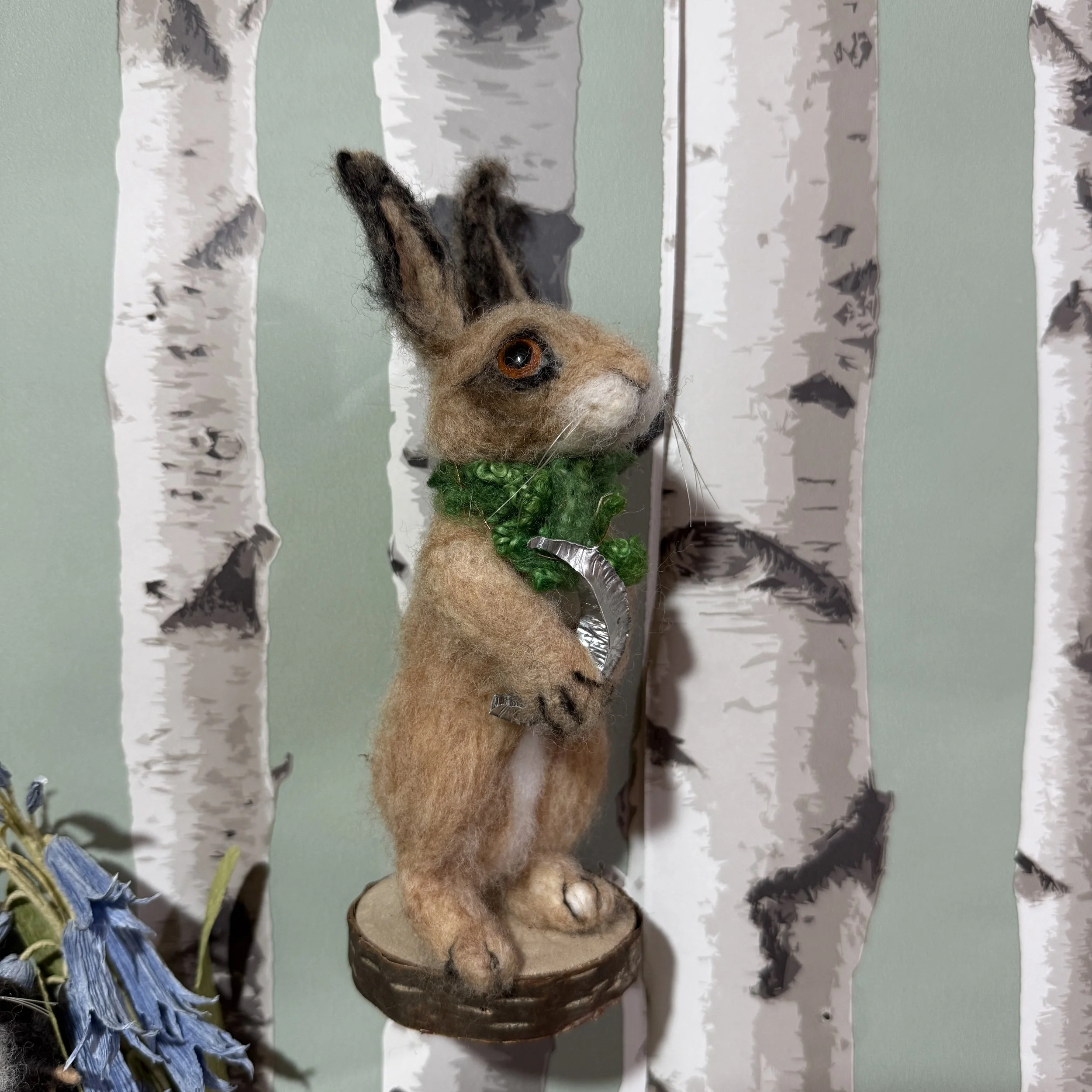 Needle felted hare with a moon. Hare is approx 17cm to tip of ears and has a wool scarf and a fold formed hammered metal moon around their neck. Can be moved and posed as you wish. £155