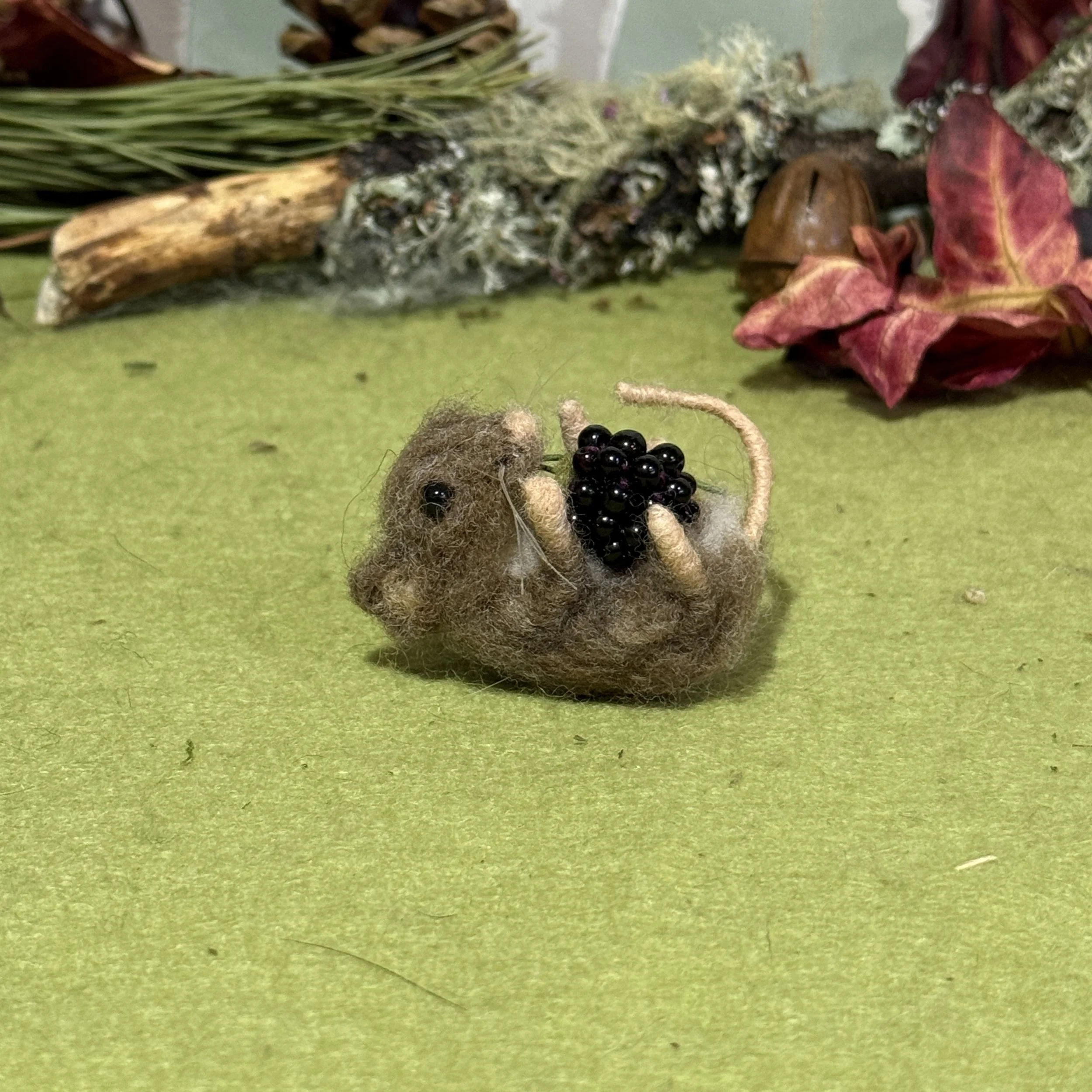 Tiny  mouse  with blackberry